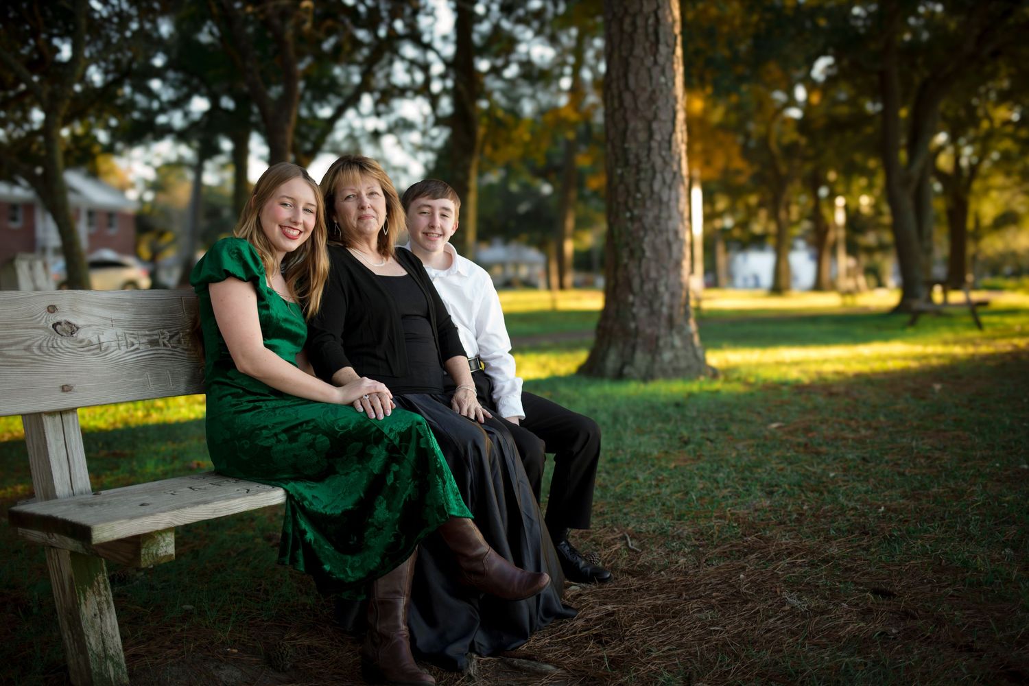 grandma and grandchildren sitting on a bench