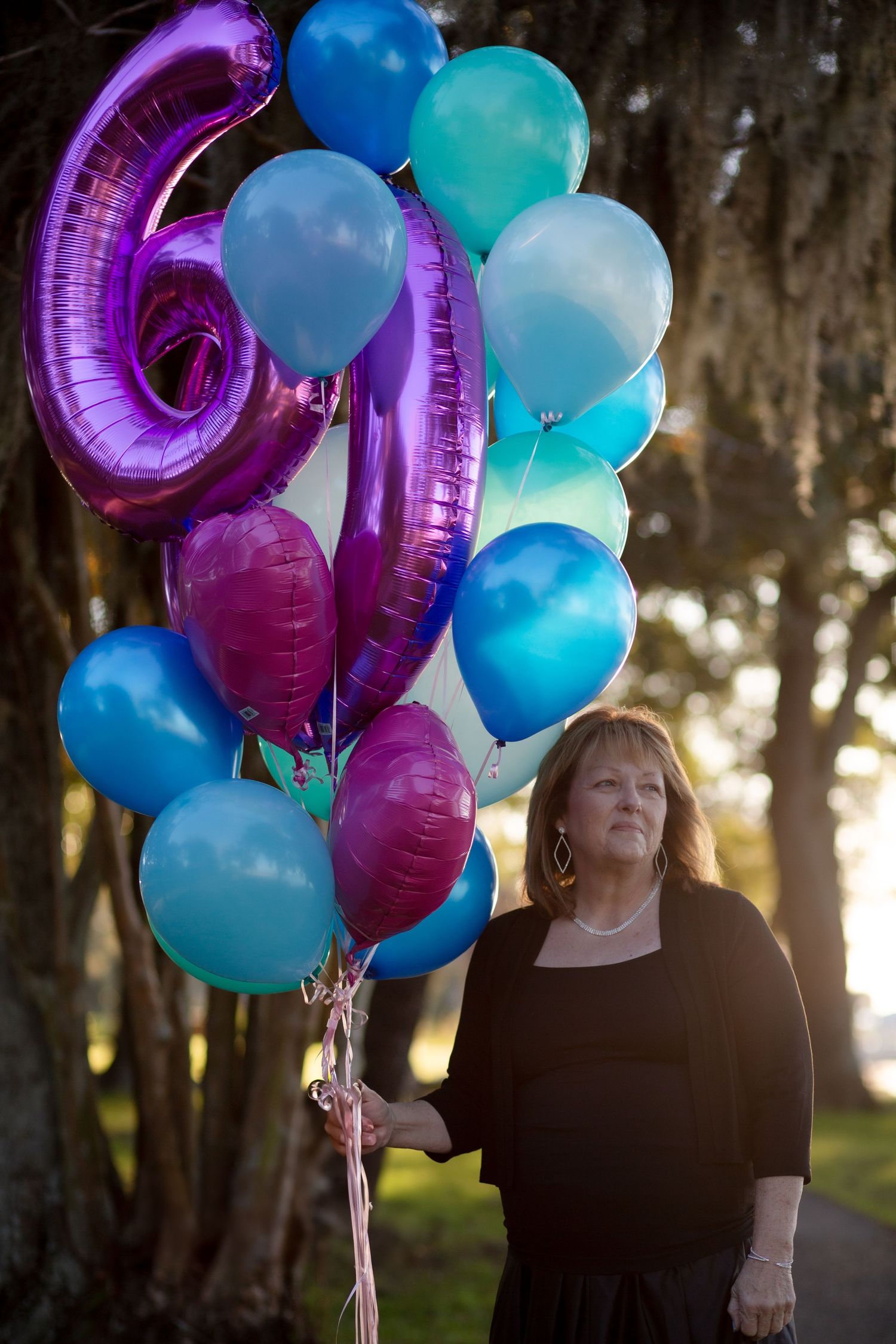 woman  with birthday balloons