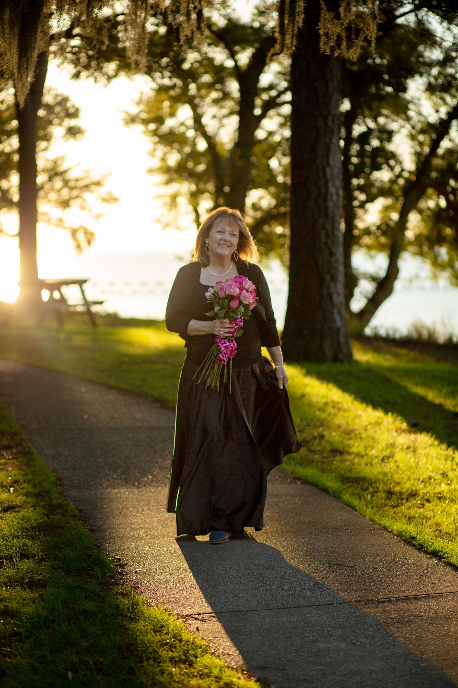 woman walking with flowers