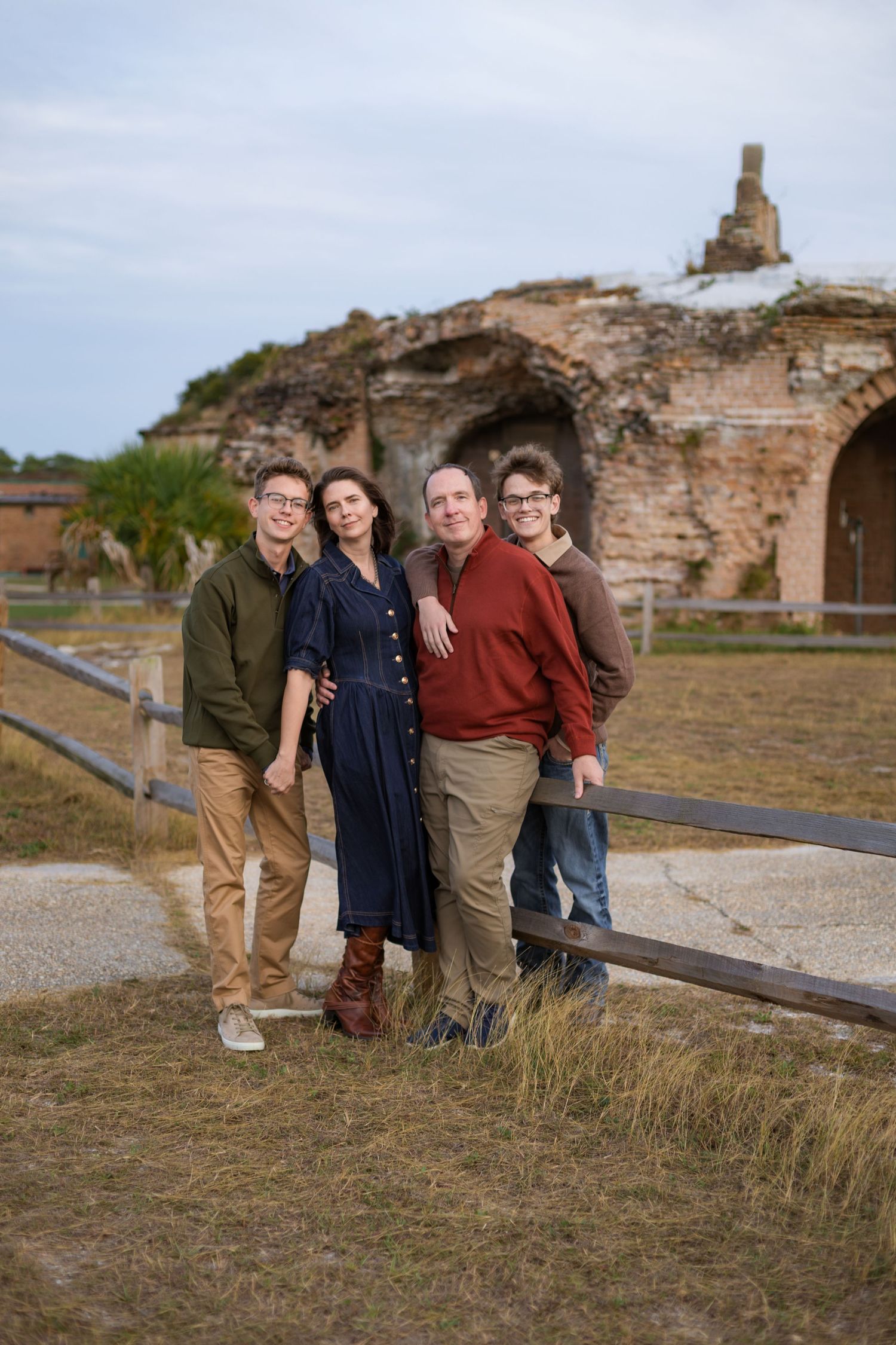 family holding each other inside fort Pickens