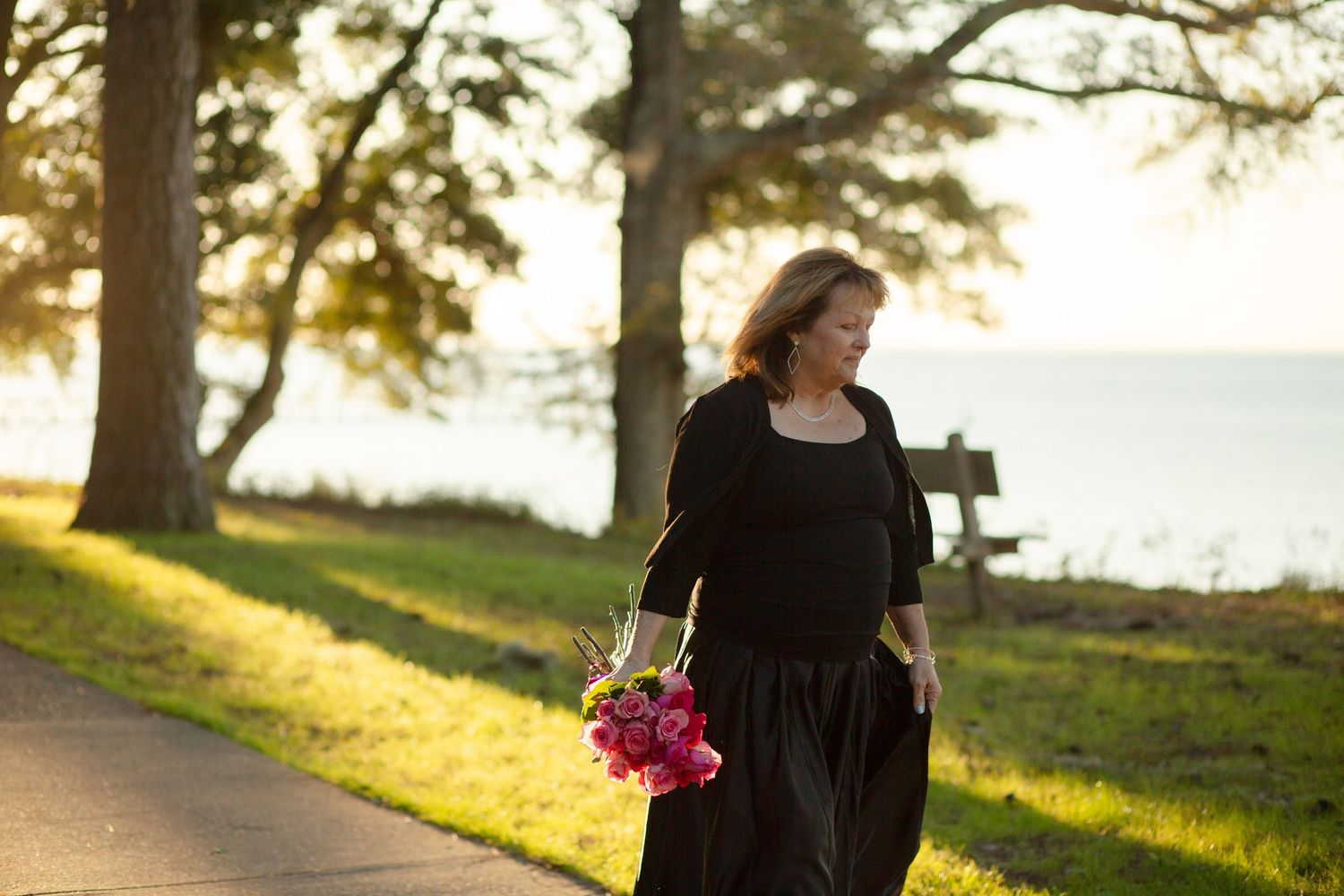 woman walking with flowers