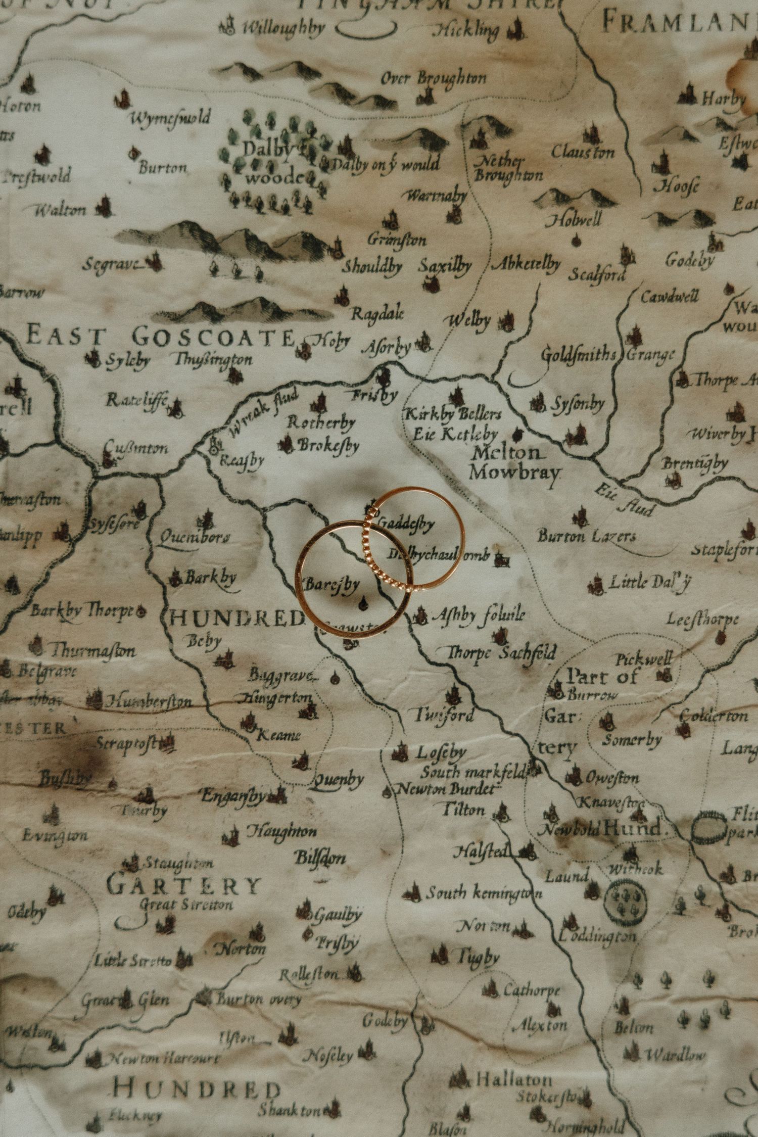 Close-up of an antique map showing various English regions and place names with detailed topographical markings.