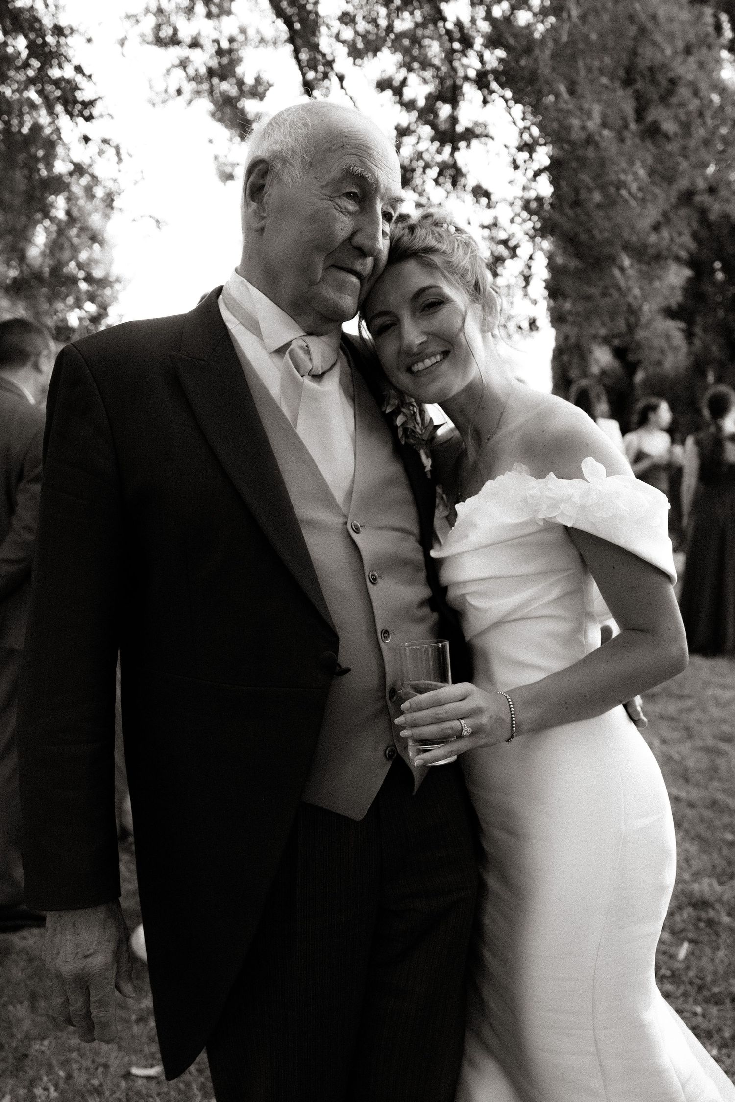 A tender moment captured between a couple in formal wedding attire.