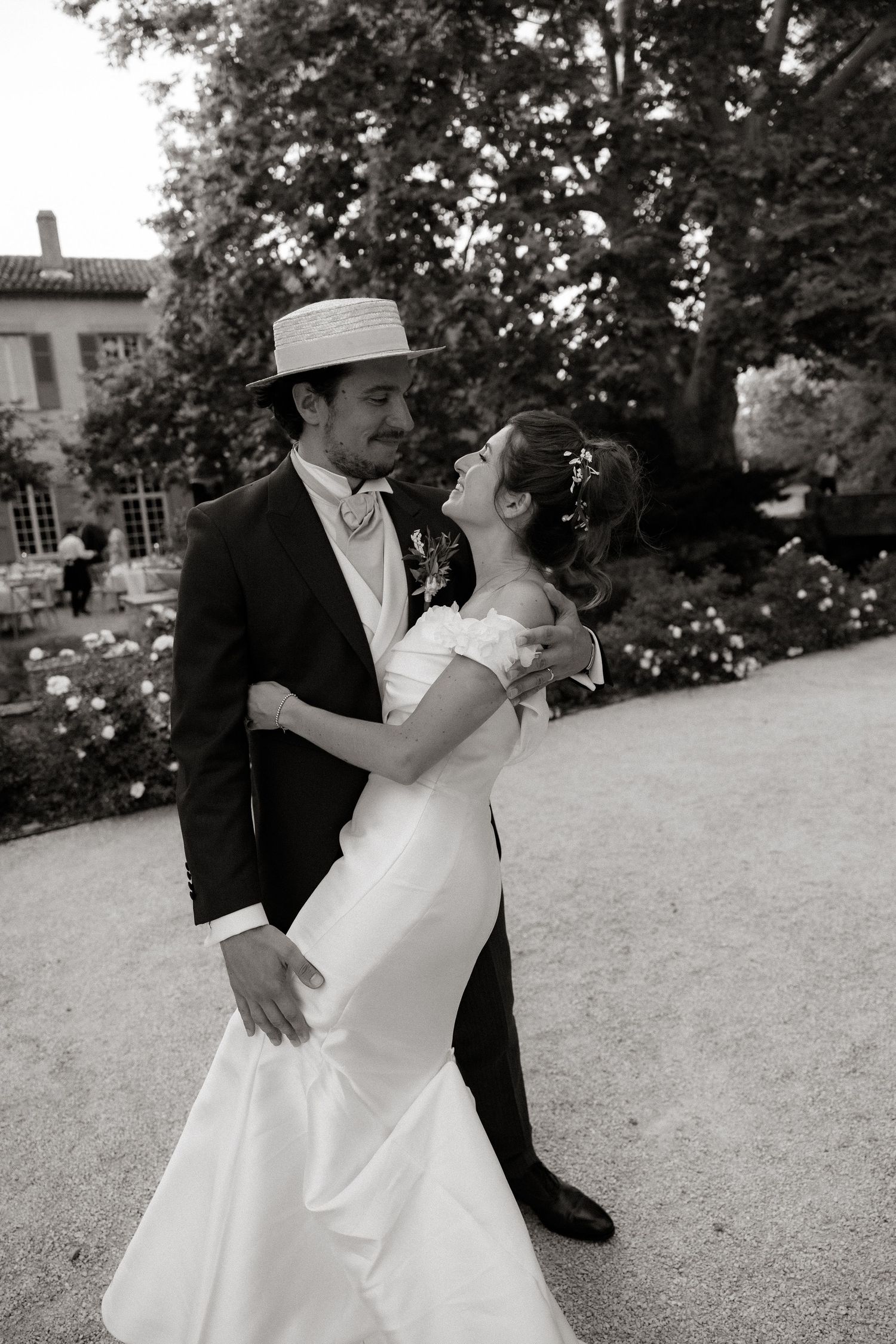 A romantic dance sequence in black and white showing a couple in wedding attire.