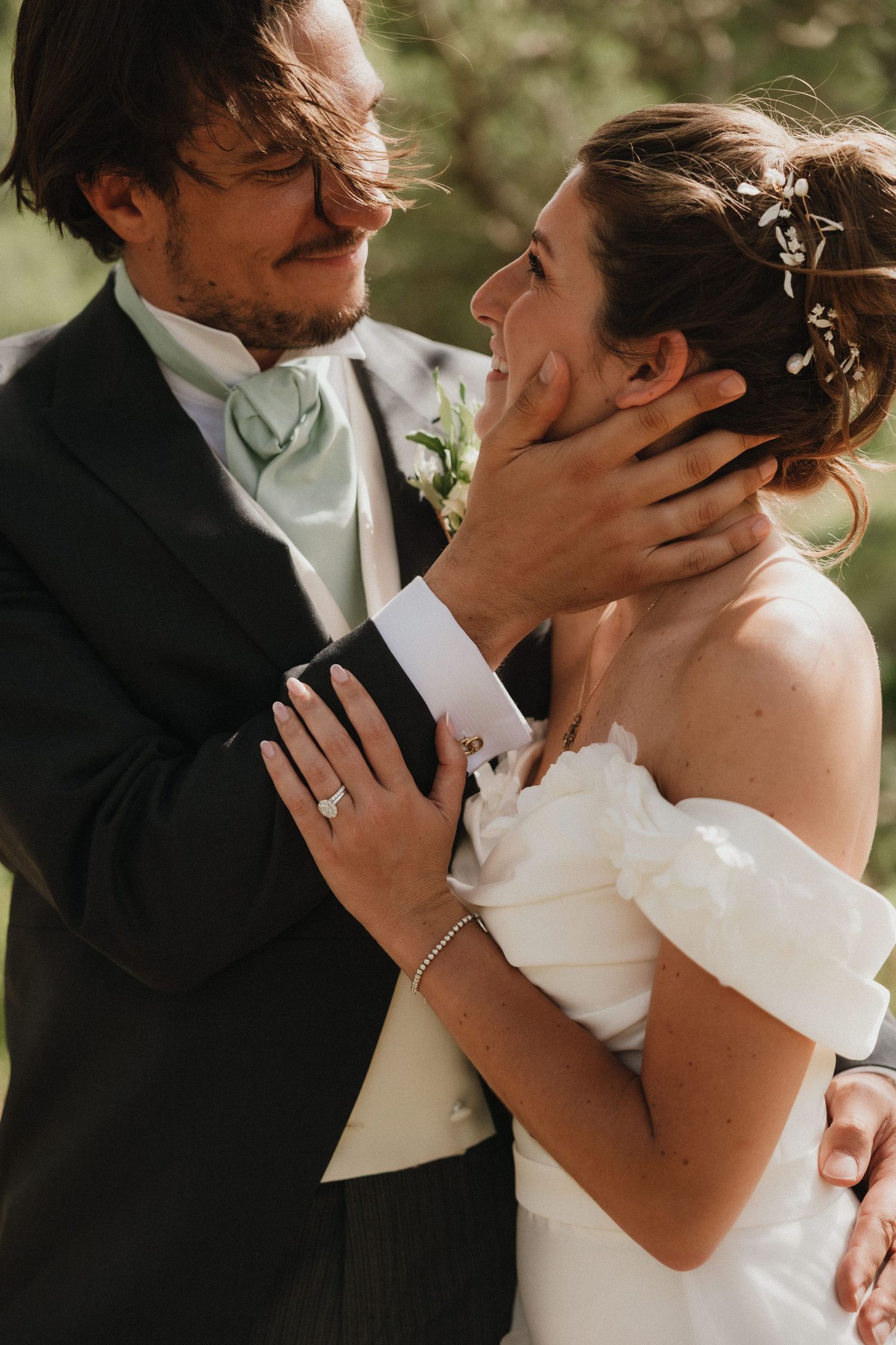 Close-up shots of an intimate wedding moment captured in a natural outdoor setting.