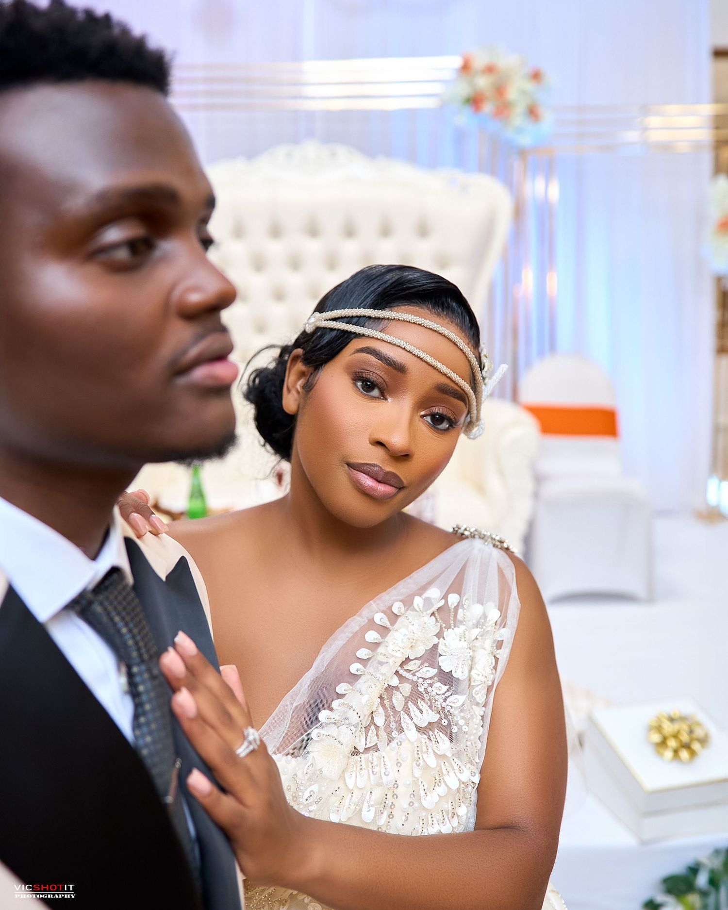 Romantic wedding portrait with sequined dress and formal attire.