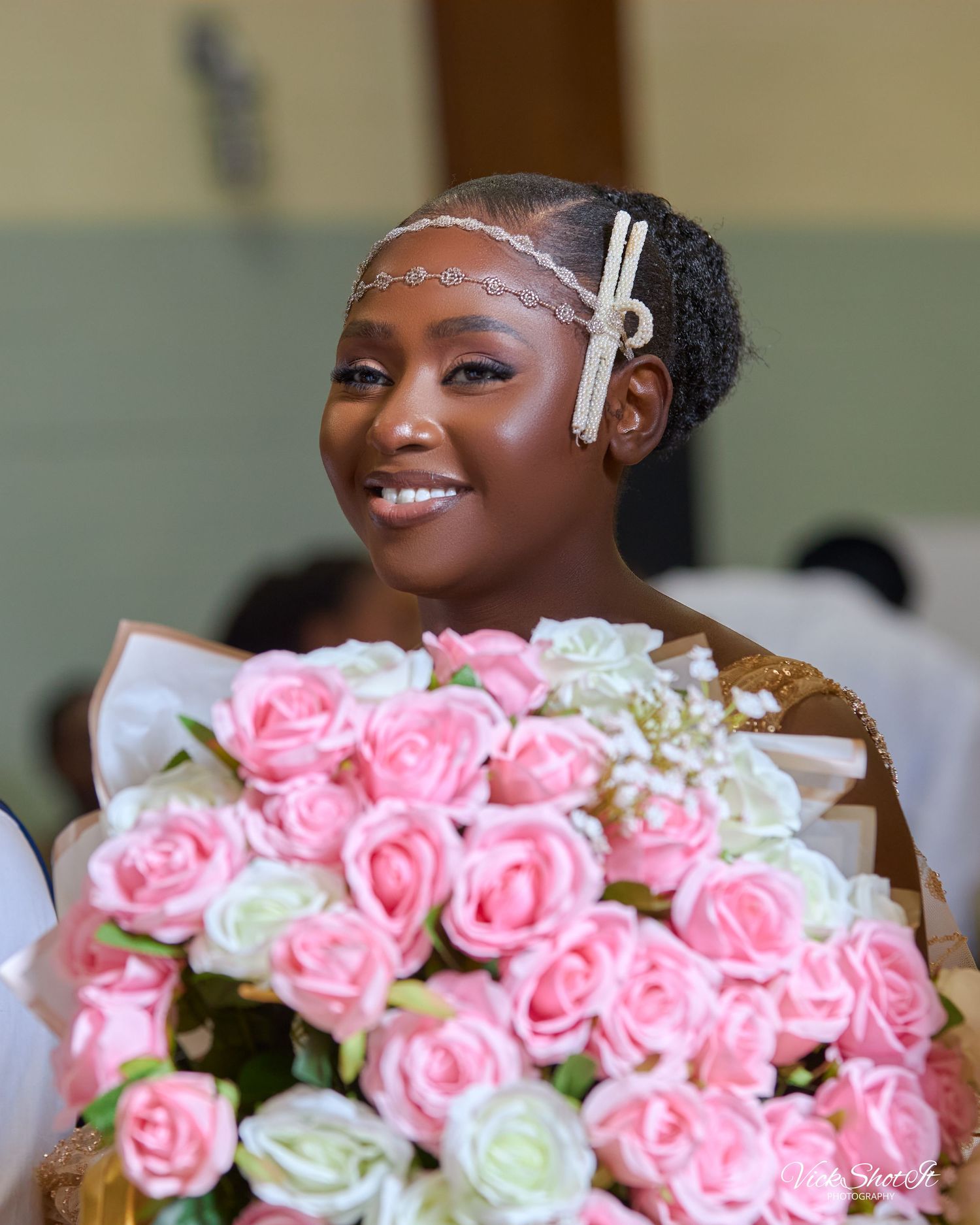 A collection of pink and white roses arranged in a wedding bouquet.