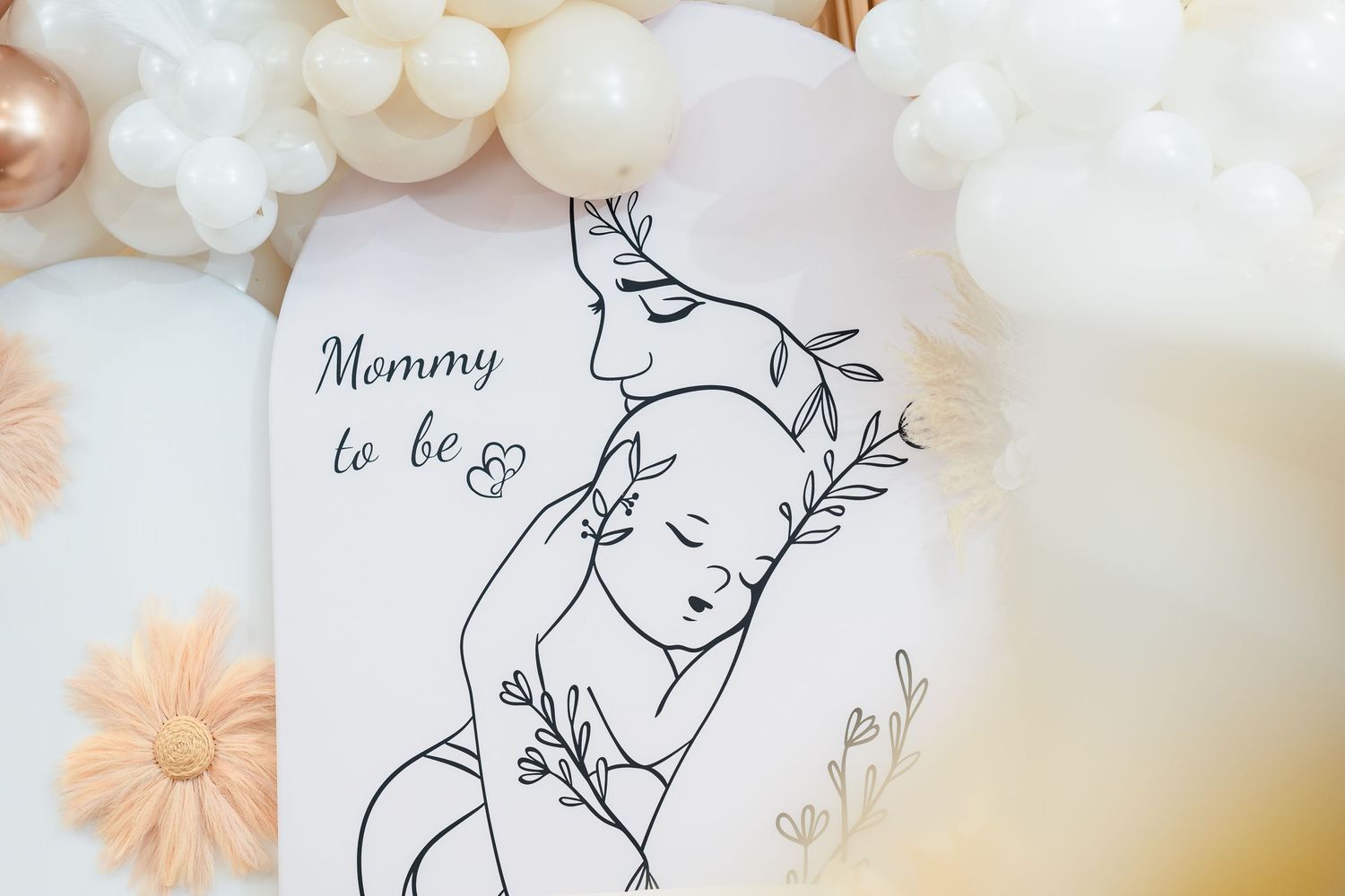 Line art illustration of mother and baby surrounded by floral elements and balloon decor.