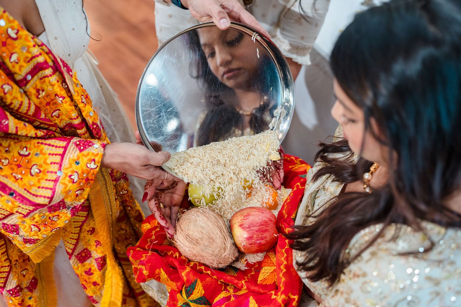 Traditional Indian ceremony ritual being performed with decorative elements and bright fabrics.