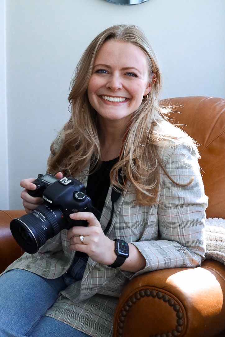 Portrait of Madison holding her camera