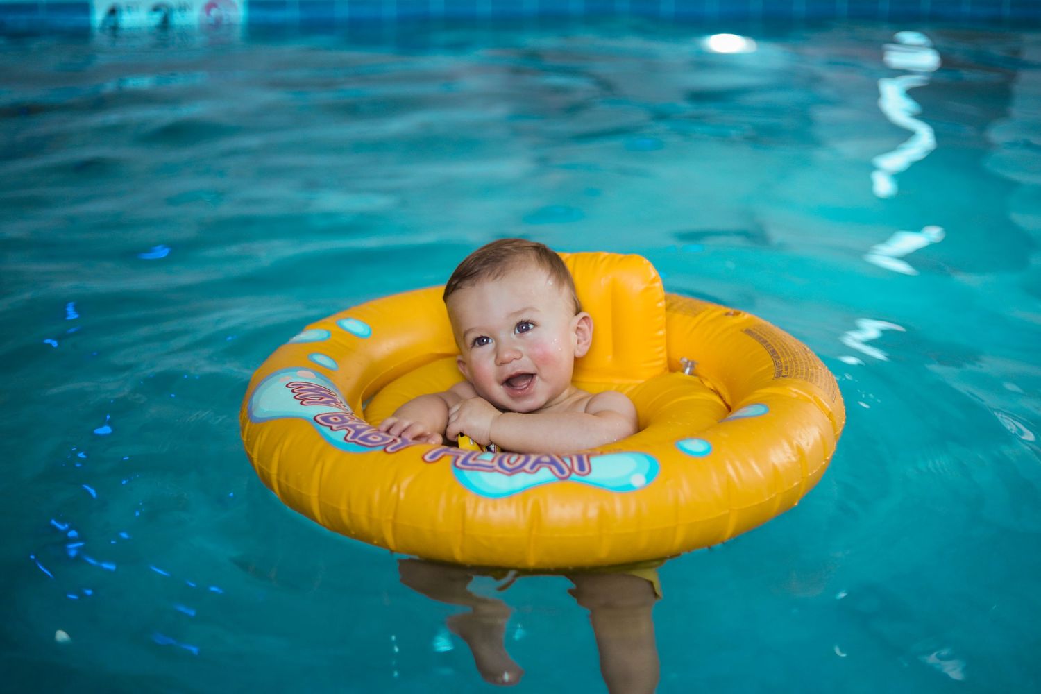 Baby in a floaty in the pool