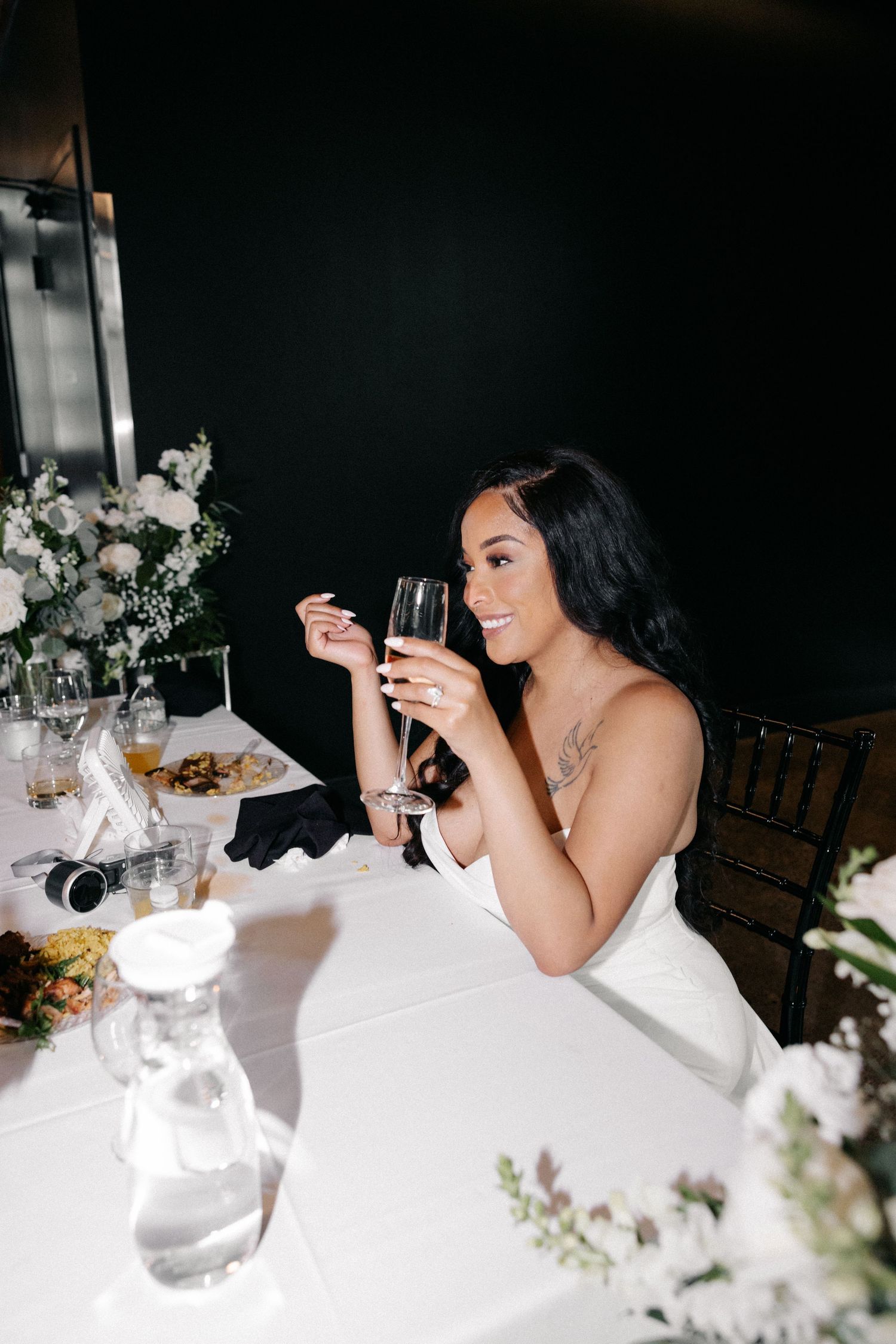 A sequence of photos showing someone in formal attire seated at an elegant dining table with flowers and glassware.