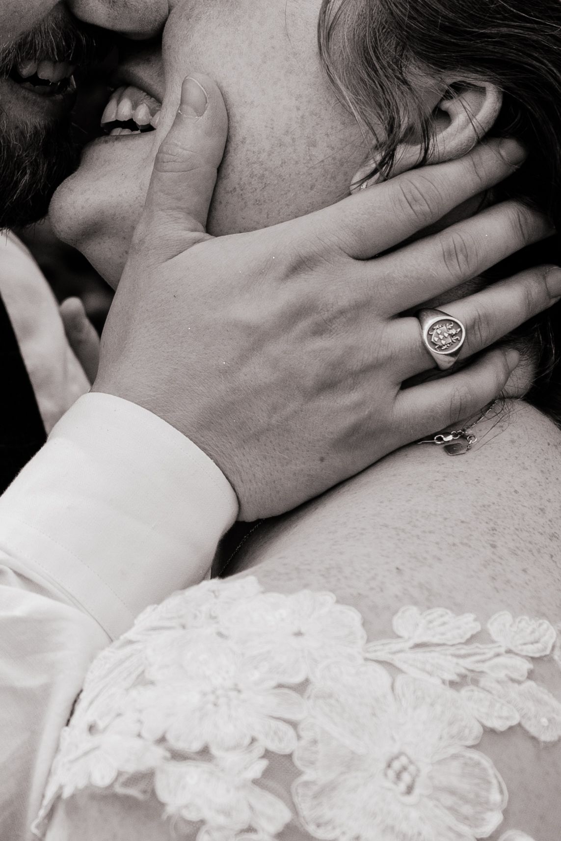 A romantic black and white photo series showing close-up intimate moments between two people embracing and kissing.