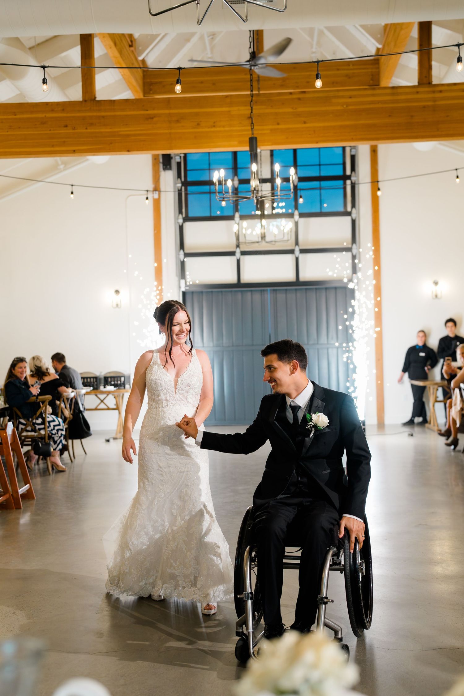 Amber and Neven Hart grand entrance at their wedding reception at Canopy Grove by Wedgewood Weddings in Escondido, California, photographed
