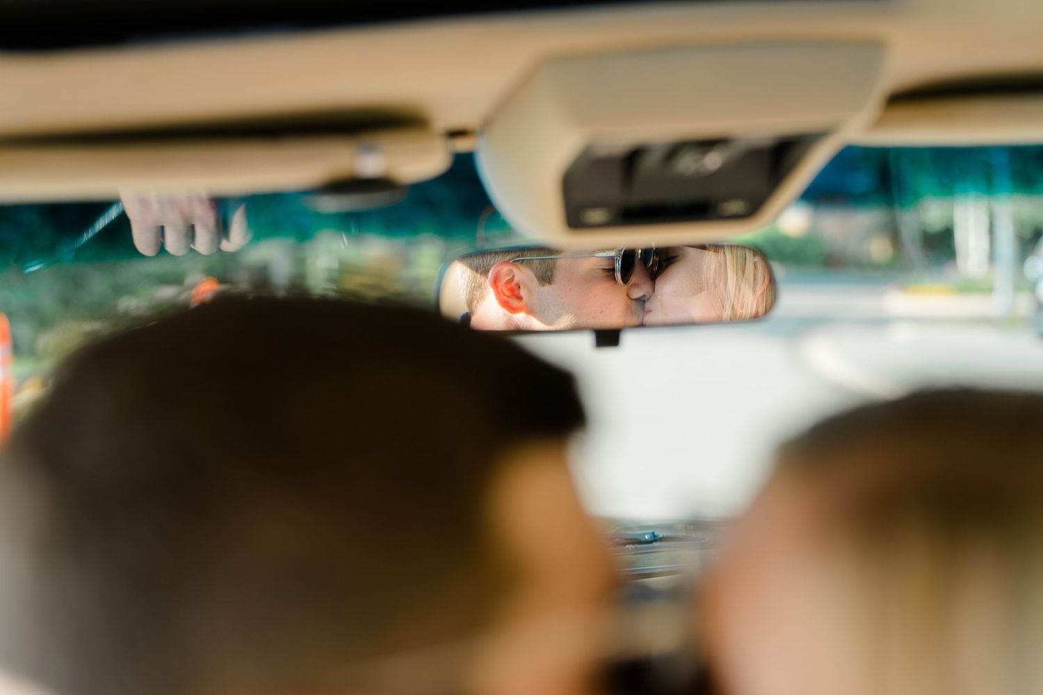 guy and girl kissing in their car