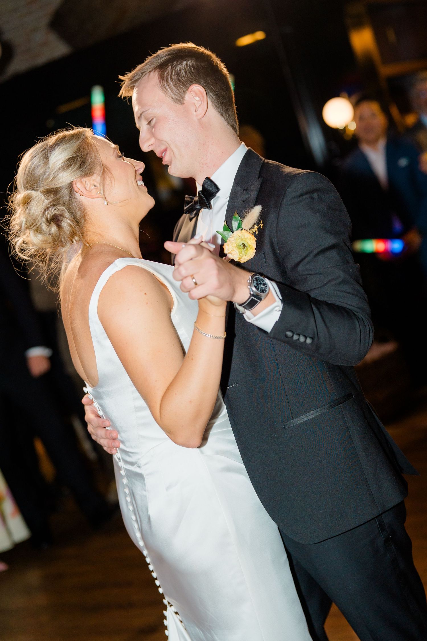 A couple shares their first dance at their wedding reception.