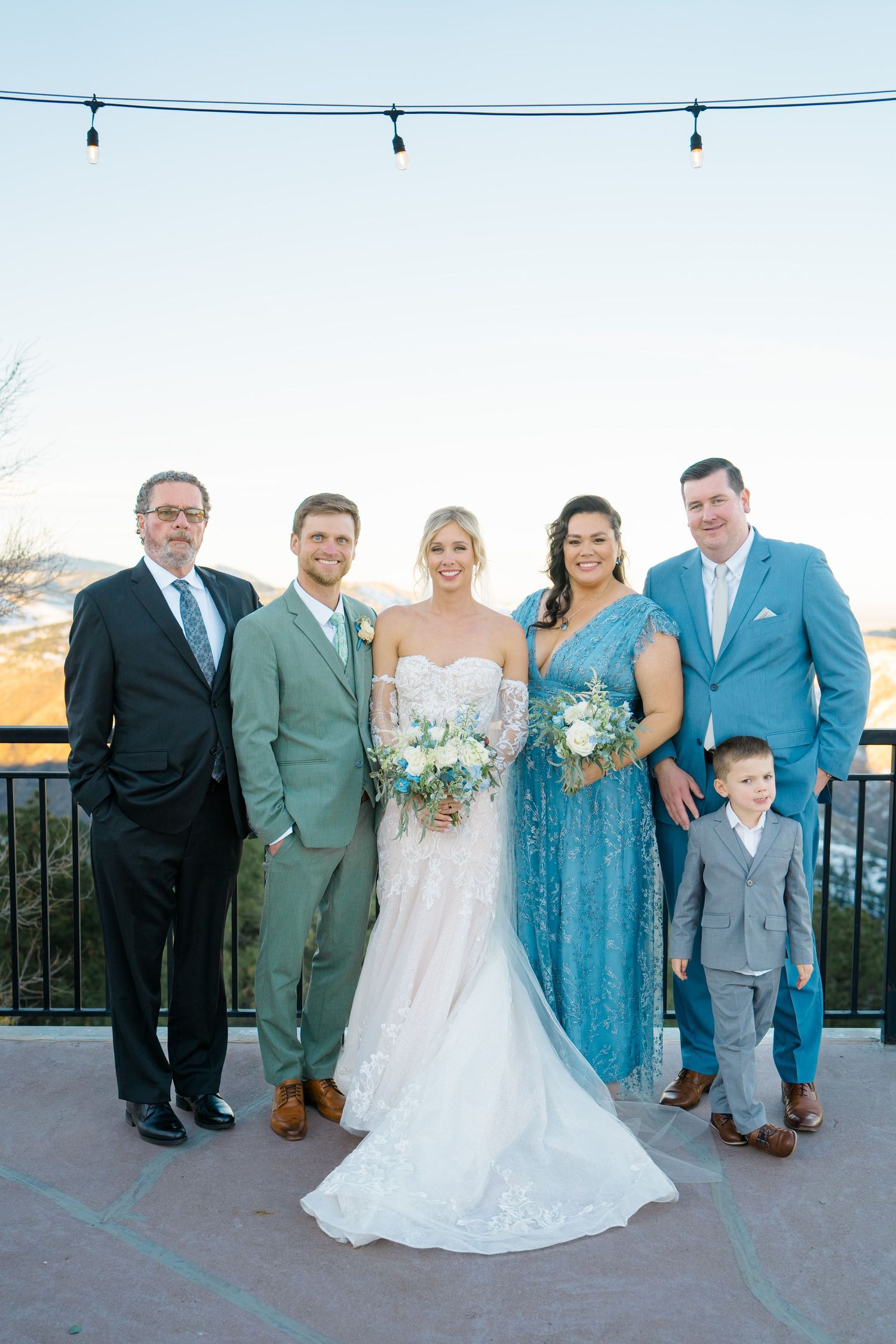 family photo at wedding in front of mountains