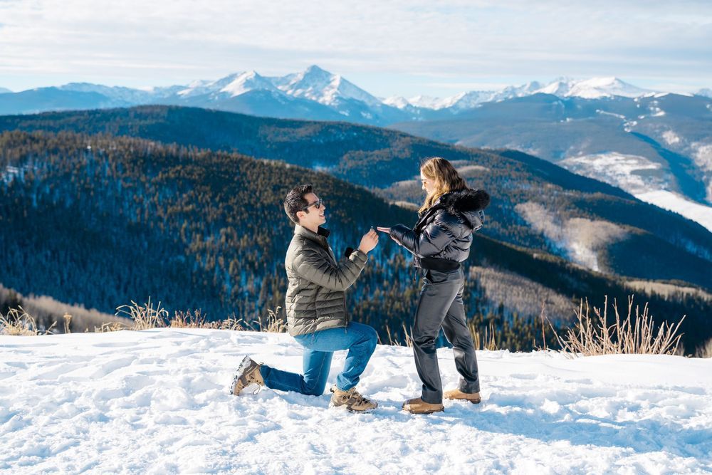 Snow-covered mountain landscape with dramatic winter scenery and distant peaks during vail proposal session.