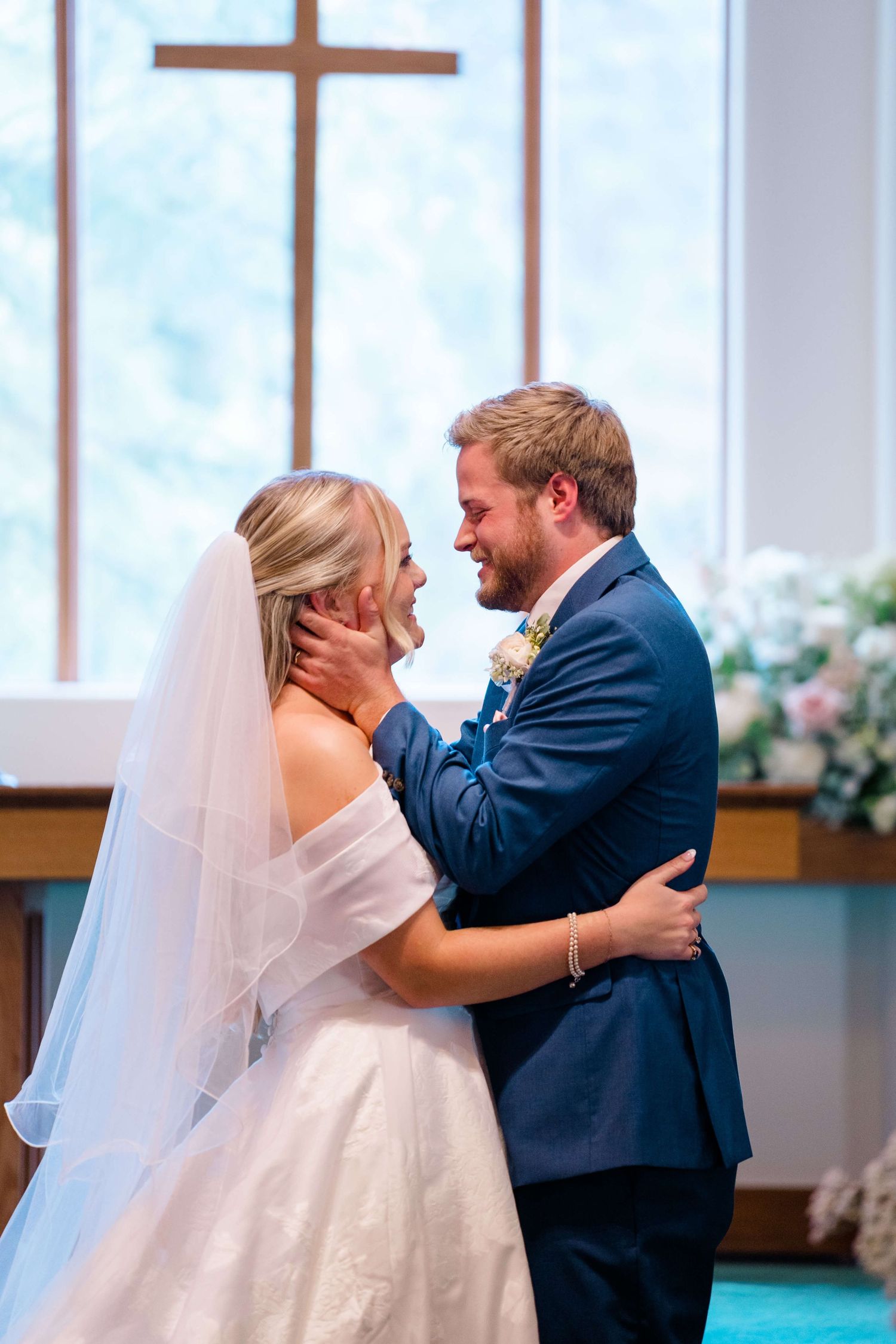 Sequence of newlyweds embracing during their first dance in a church with bright windows at vail wedding.
