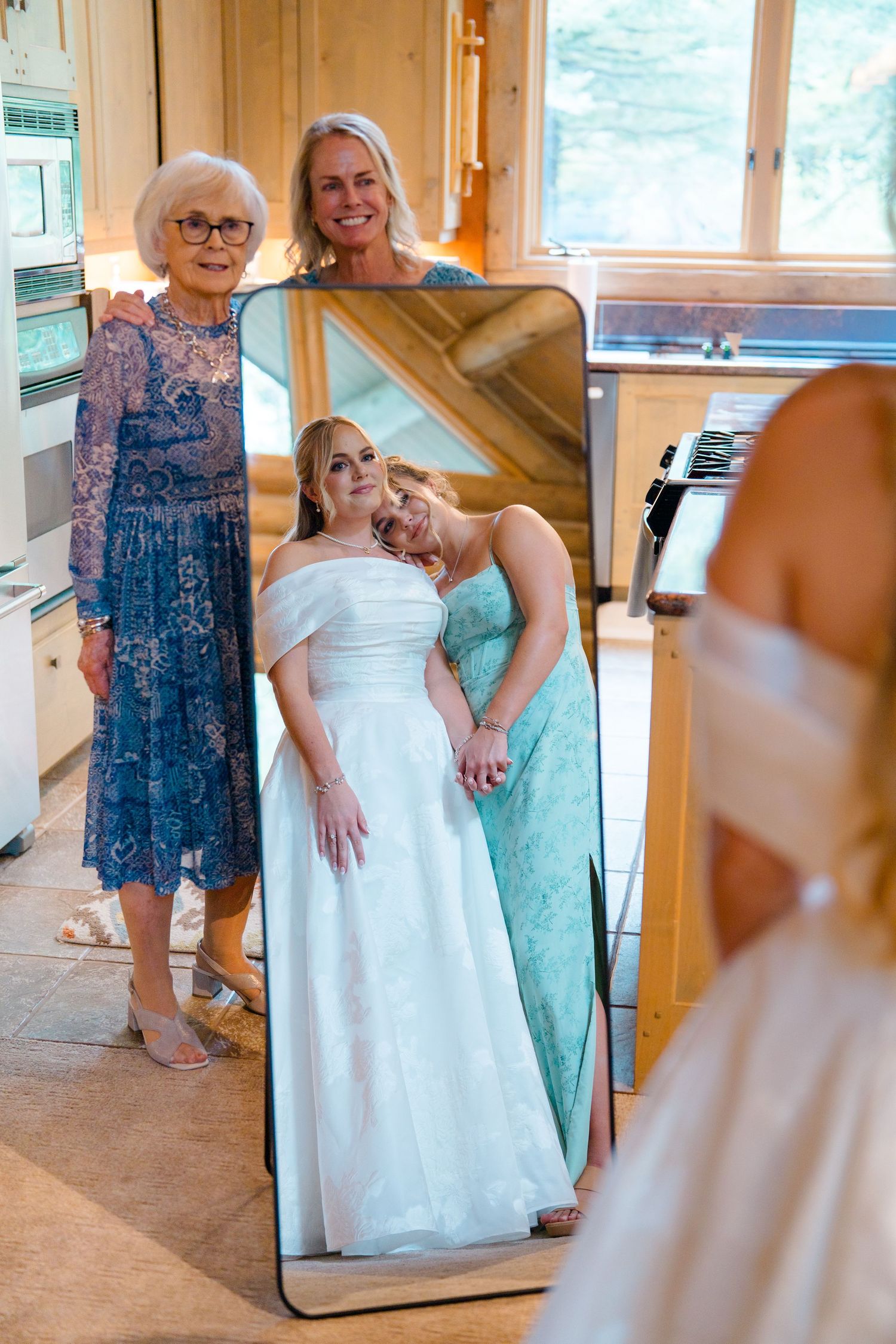 A series of candid moments showing people getting ready in a wooden cabin room with mirrors and natural light.