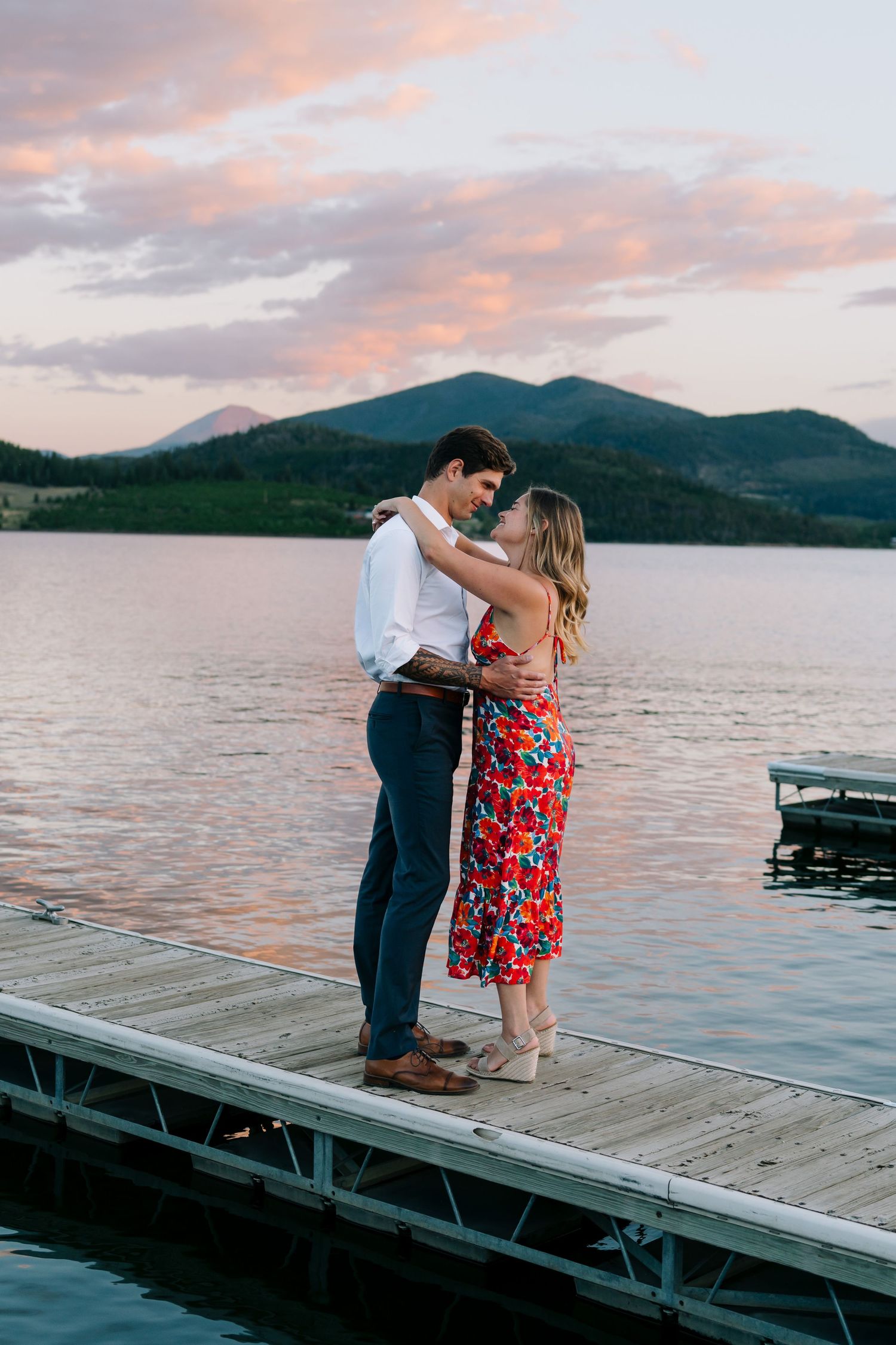 guy and girl on boat dock embracing