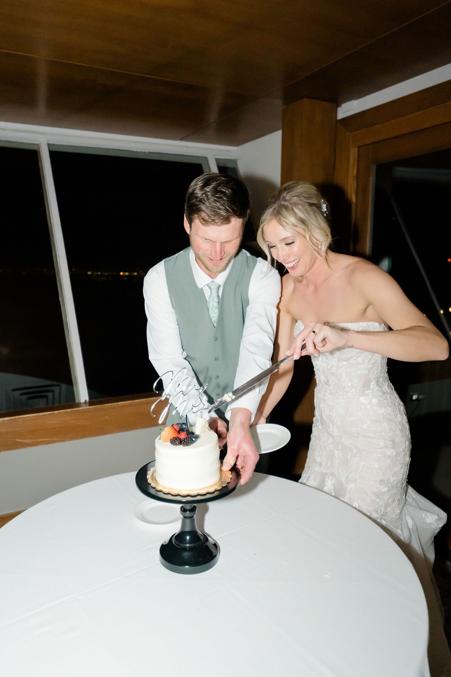 couple cutting wedding cake