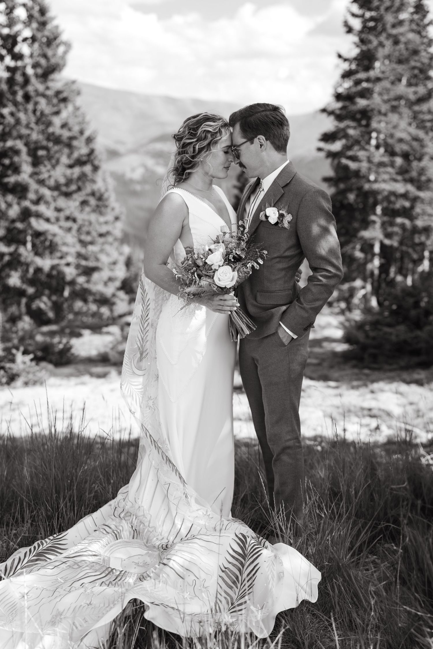 bride and groom on at lunch rock winter park colorado