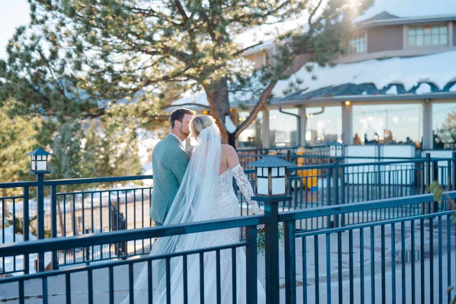 couple kissing and walking out of wedding