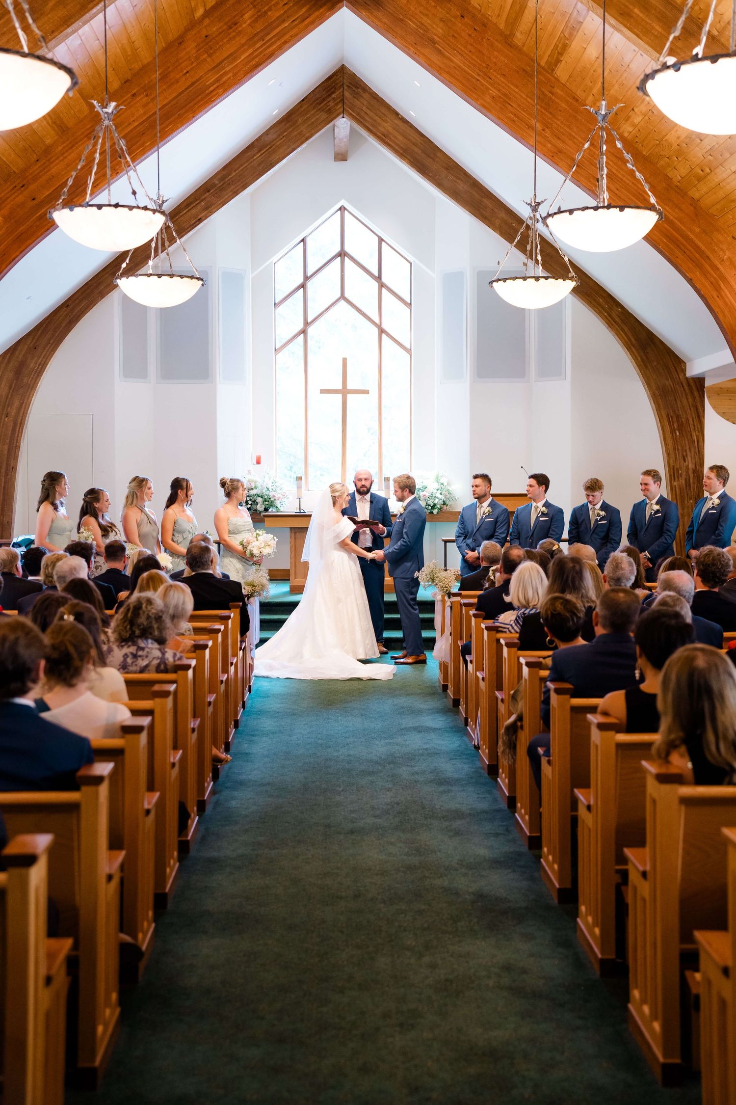 A sequence of photos showing a traditional church wedding ceremony with guests seated in wooden pews under vaulted ceilings at vail wedding.
