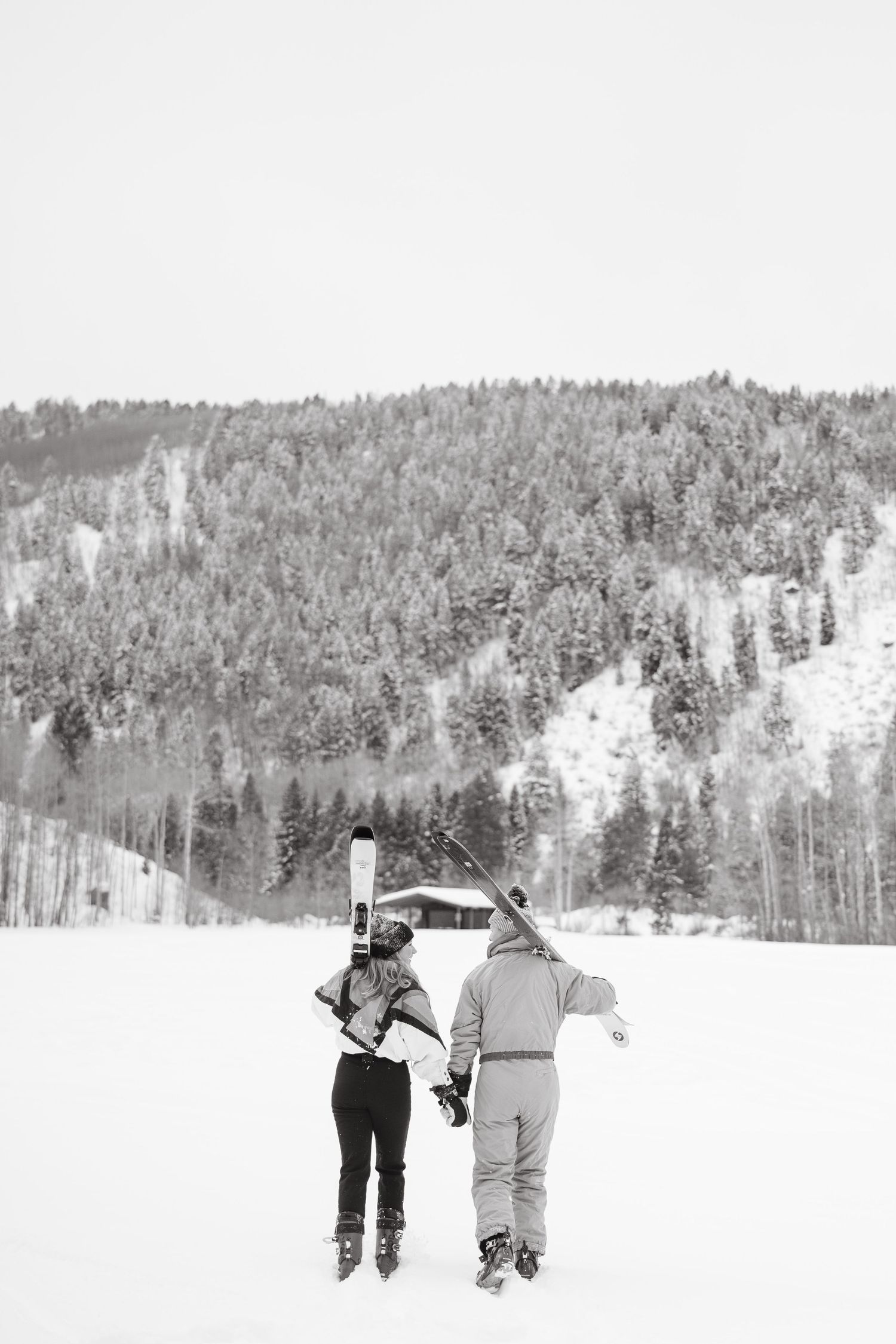 black and white ski photos walking from the camera