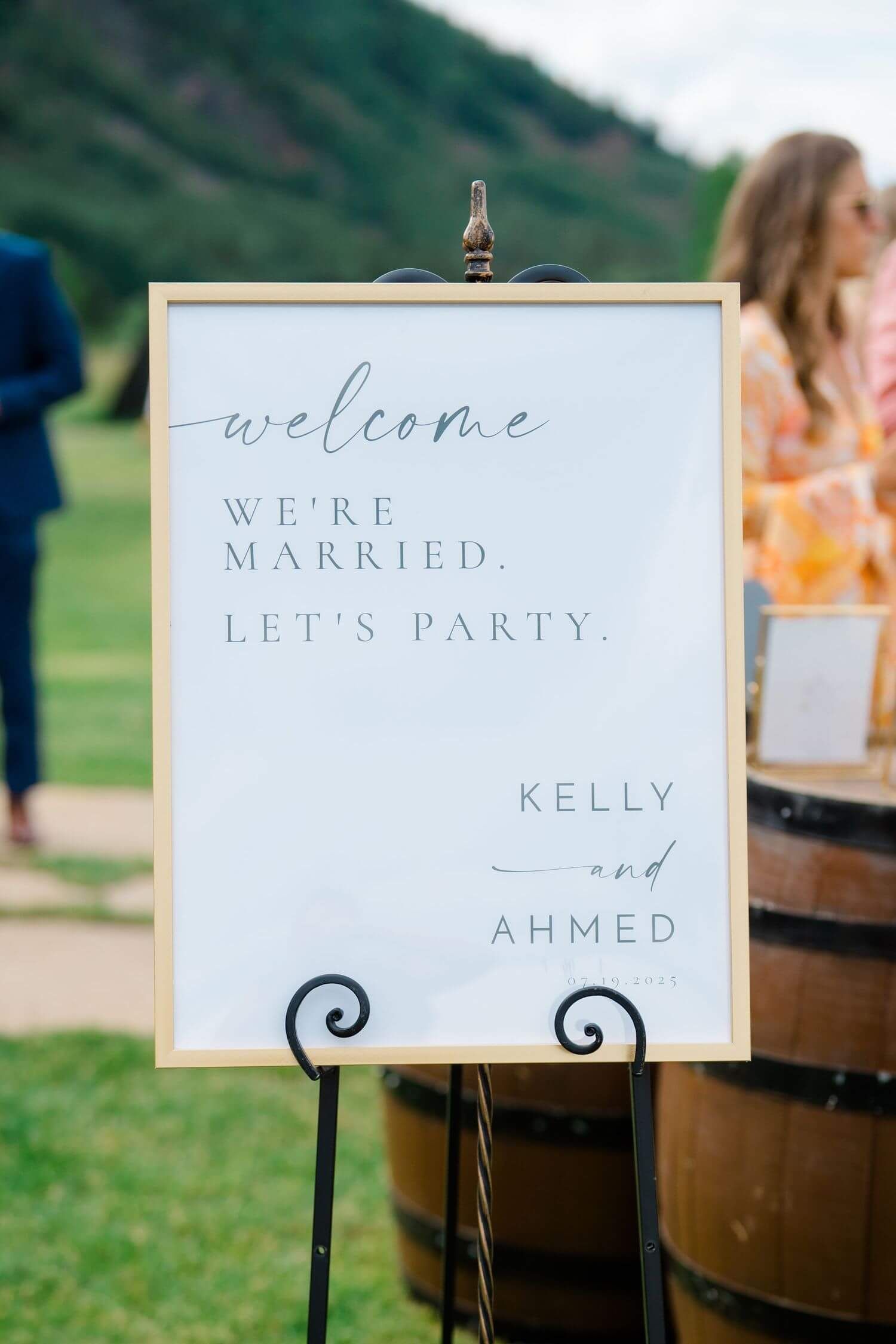 Camp Hale Wedding welcome signs with elegant calligraphy displayed on black stands at an outdoor venue.