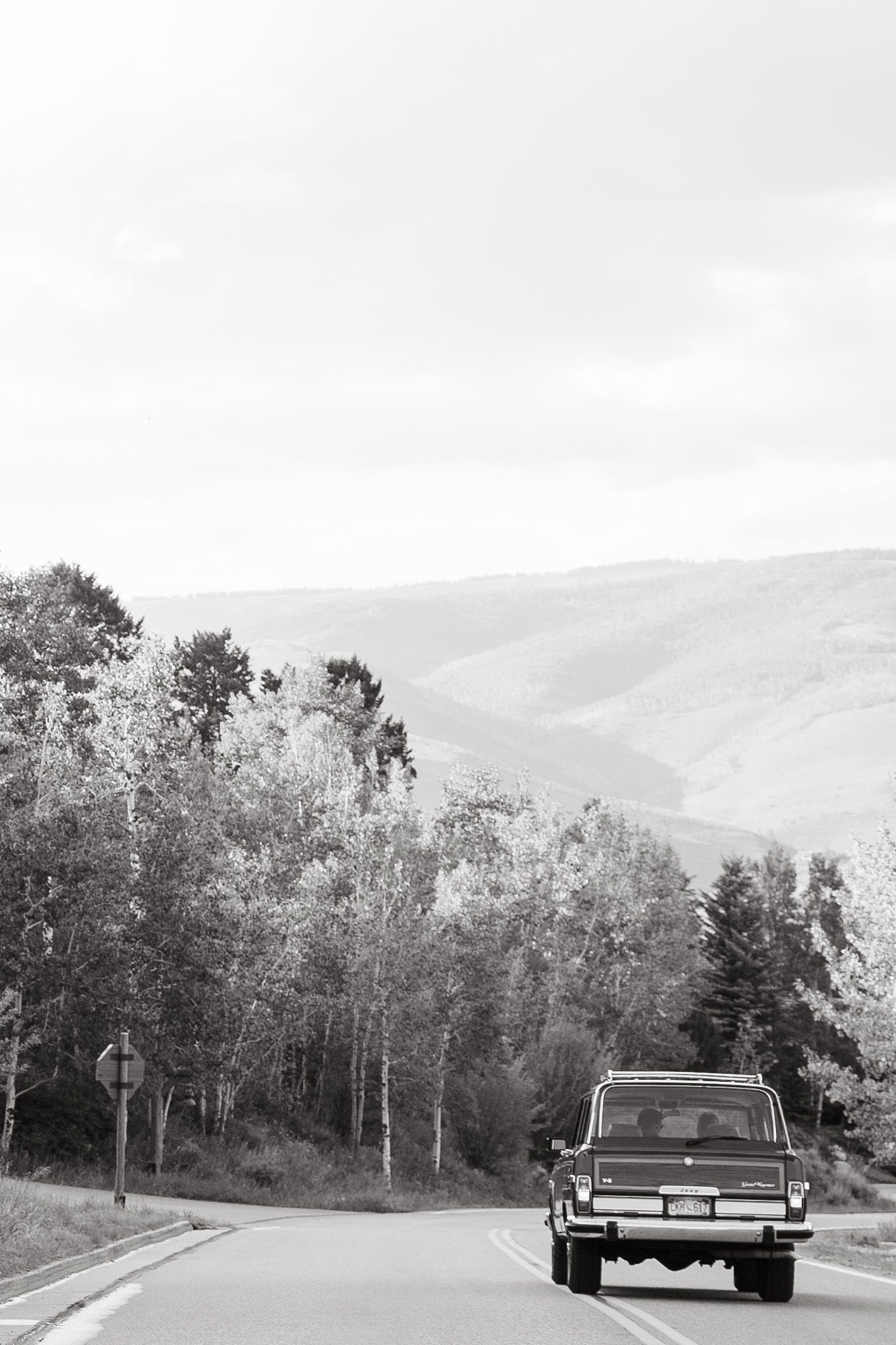 couple driving car in bachelor gulch