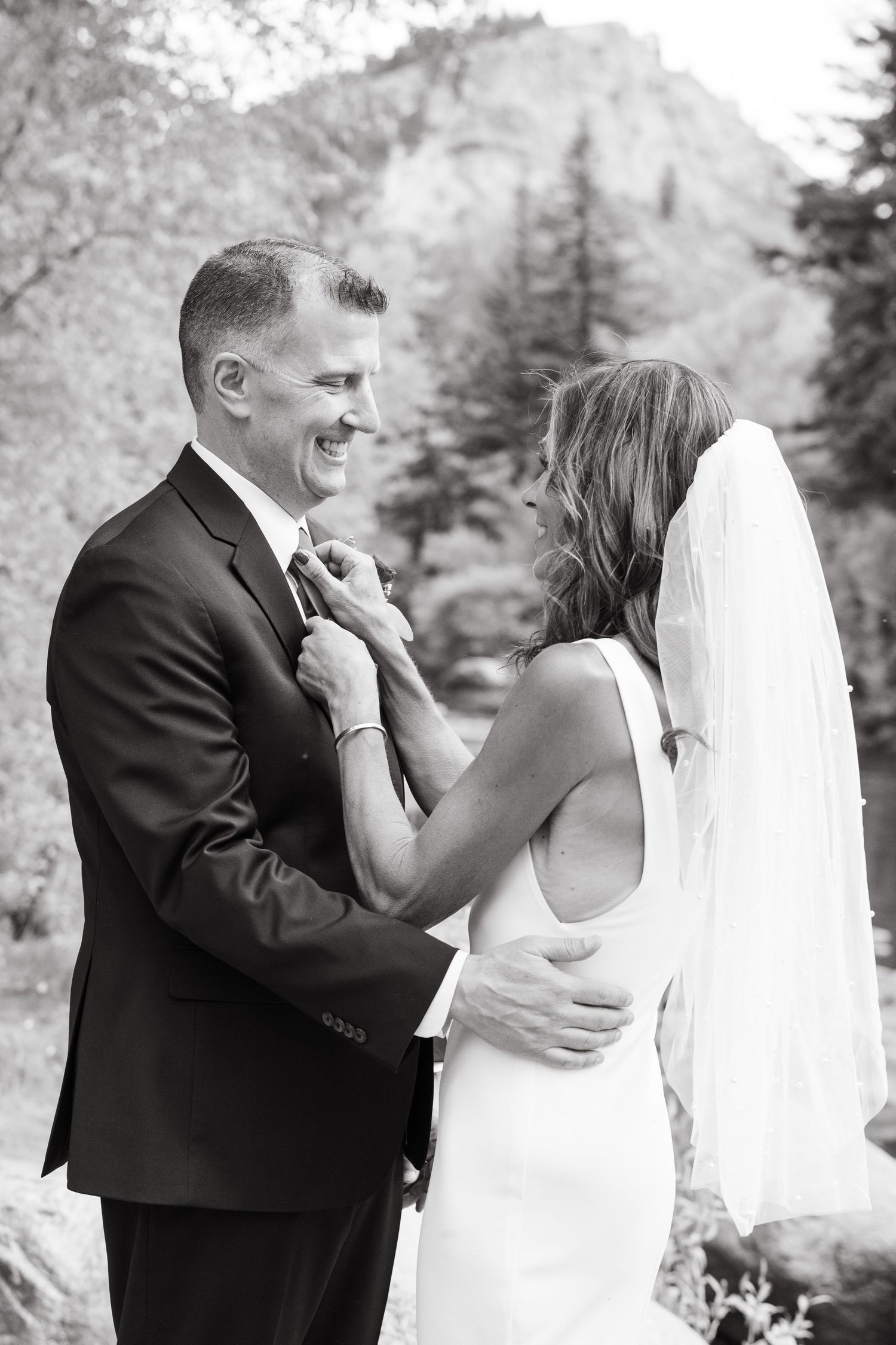 Black and white wedding photos showing intimate moments between newlyweds captured by Vail Wedding Photographer.