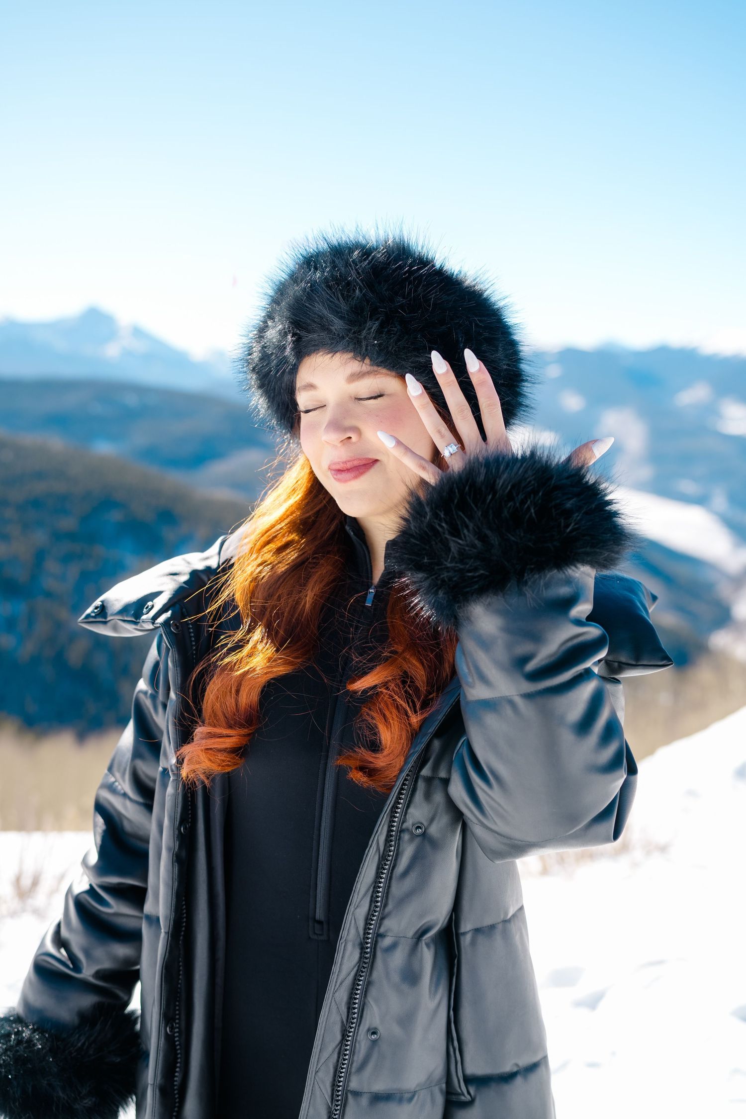 A series of candid shots showing someone in a winter coat with snow-capped mountains in the background of vail proposal.