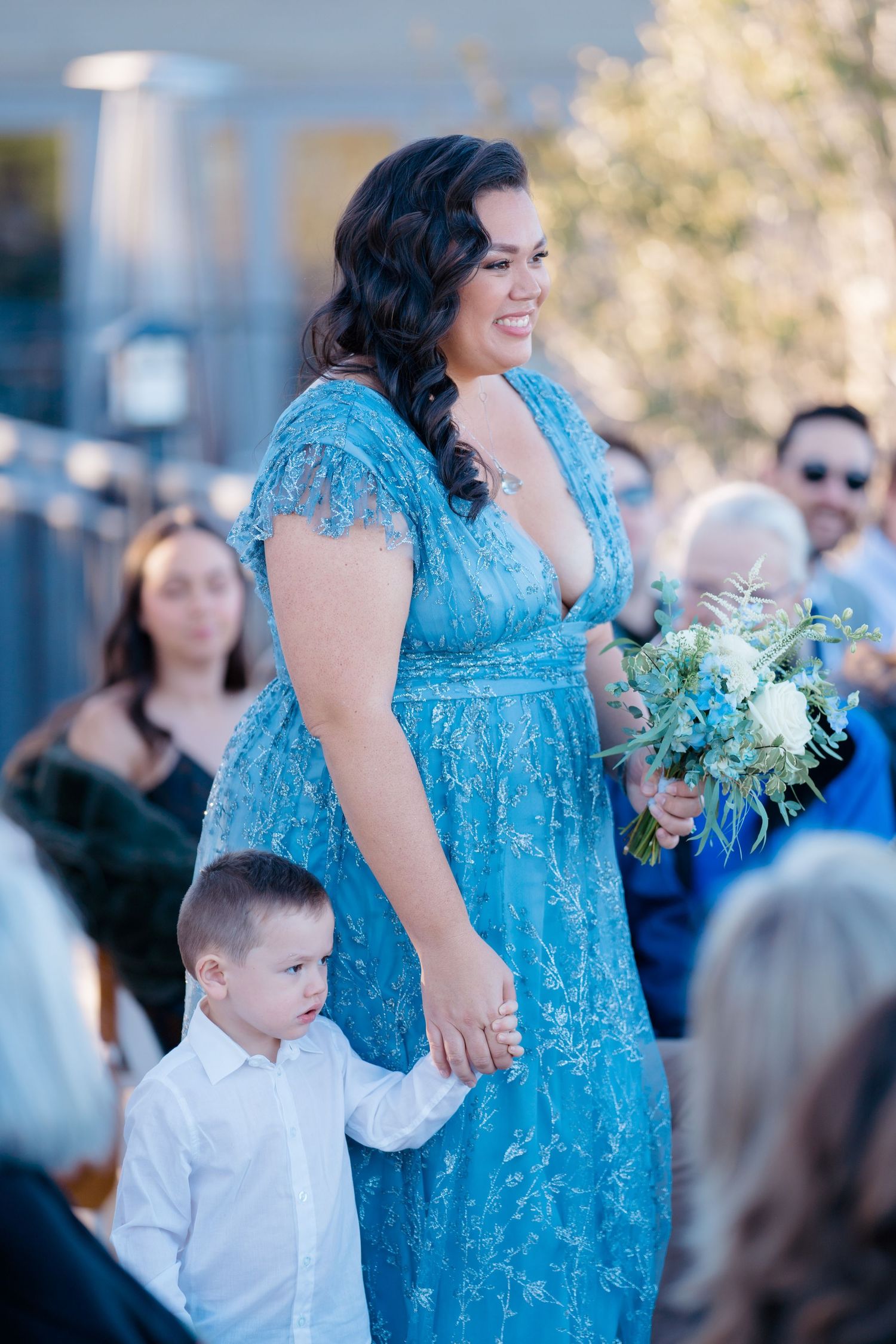 bridesmaid walking with son
