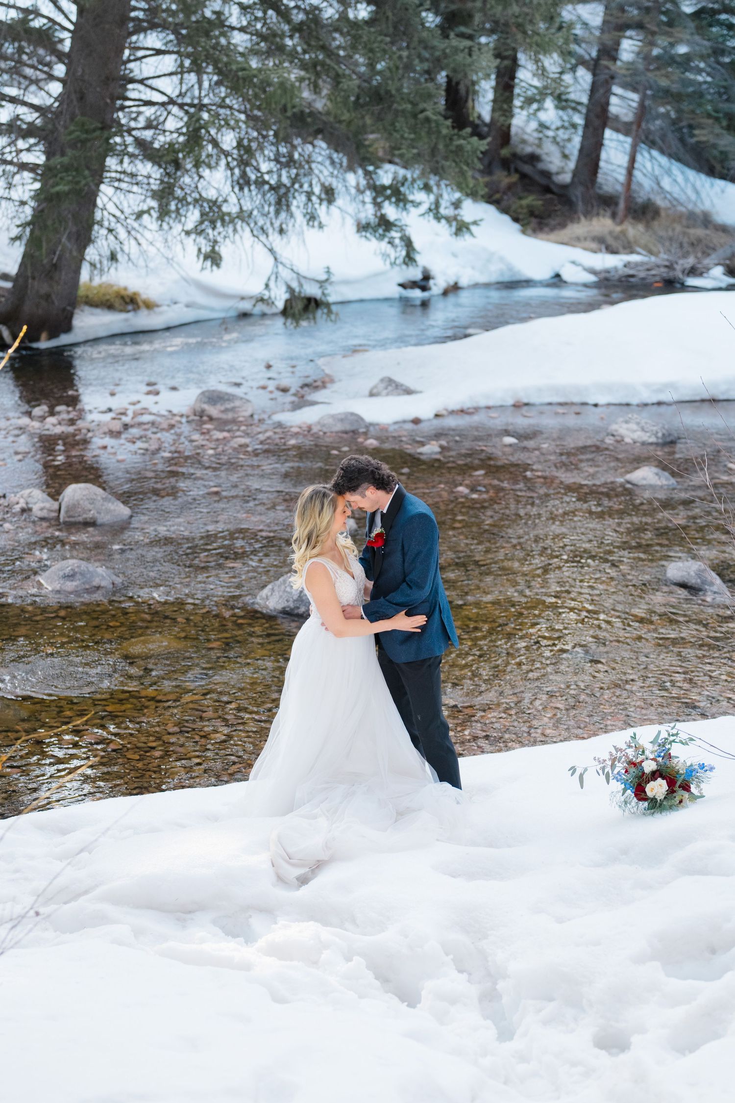 bride and groom looking at each other and kissing