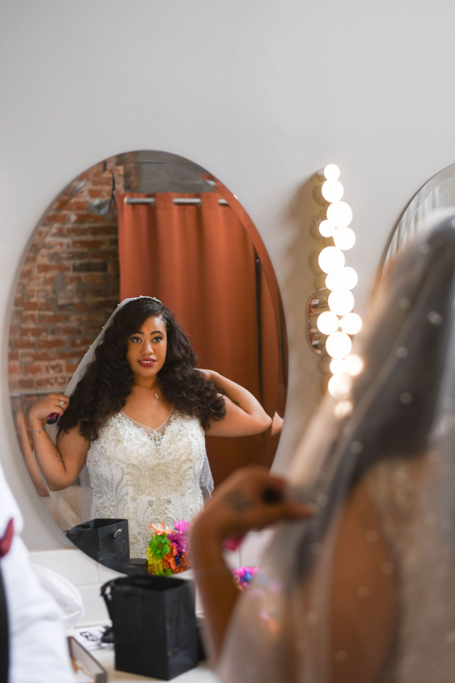 Kansas City bride looking in mirror