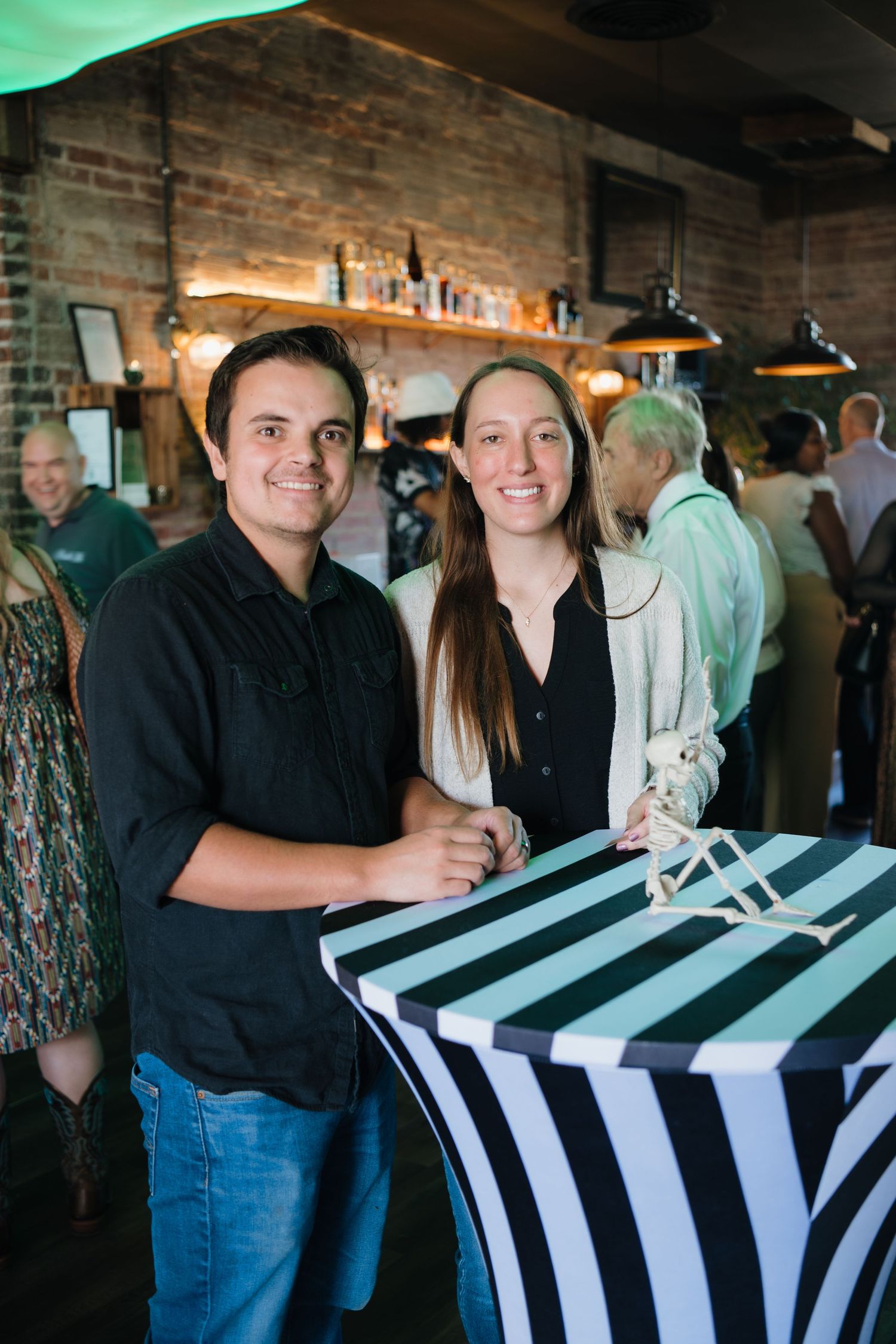 owners of rustic wedding event rentals posing at sugar hollow crossing