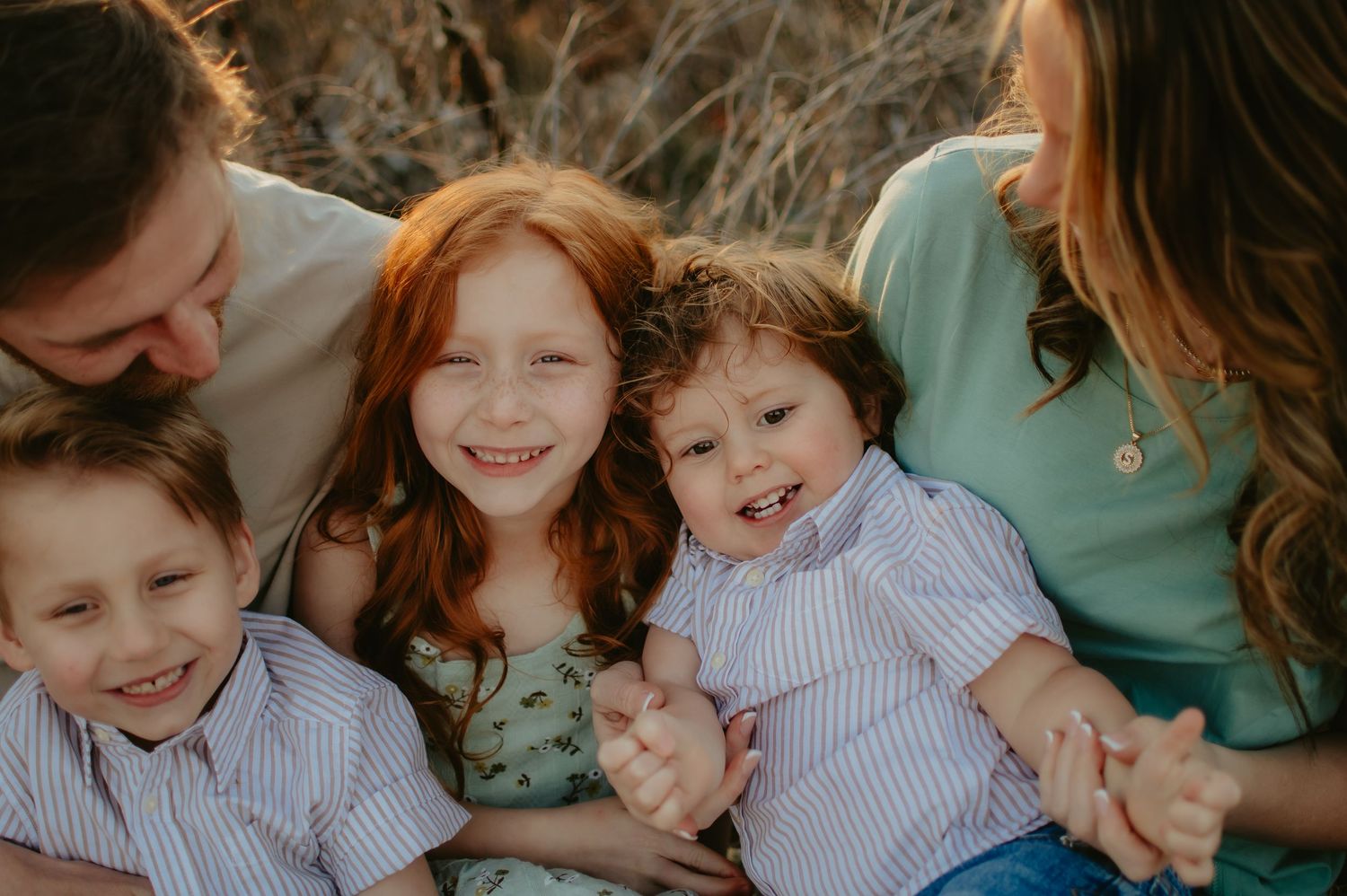 Joyful outdoor family session filled with laughter, candid moments, and natural light — capturing love in its most authentic form.