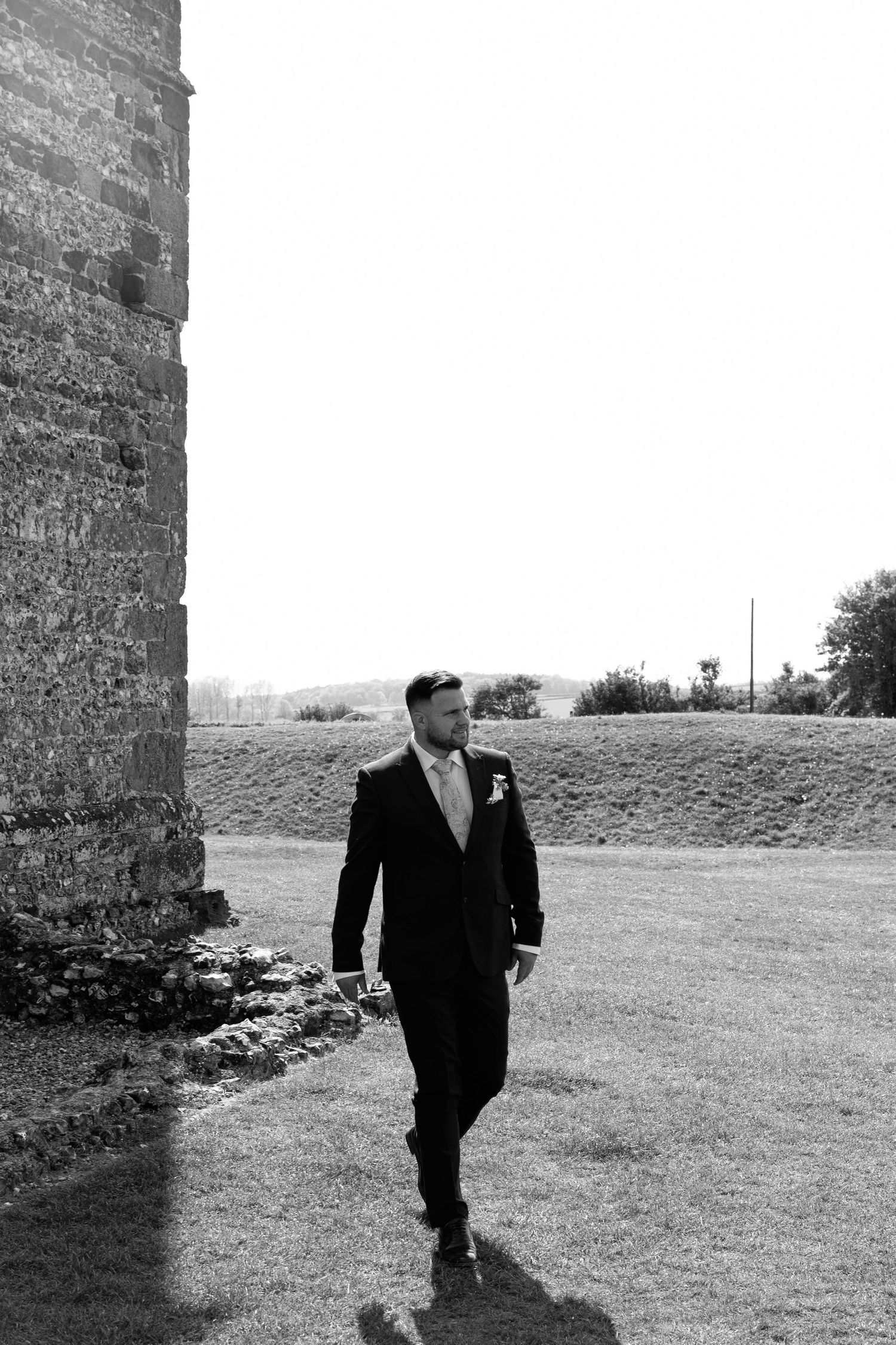 groom, wedding day, groom prep, groom walking posing, wedding photographer, excited groom, happy