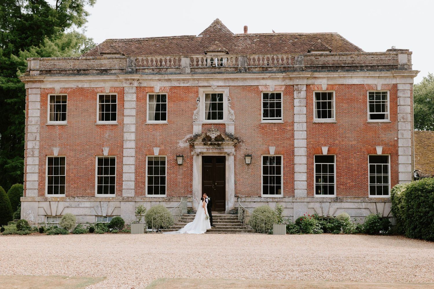 Bride and groom at Deans Court, Wimborne, Dorset.