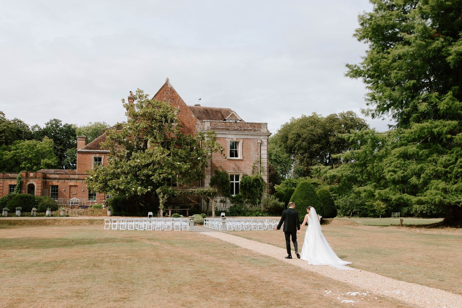 Couple portraits of bride and groom at Deans Court in Wimborne, Dorset.