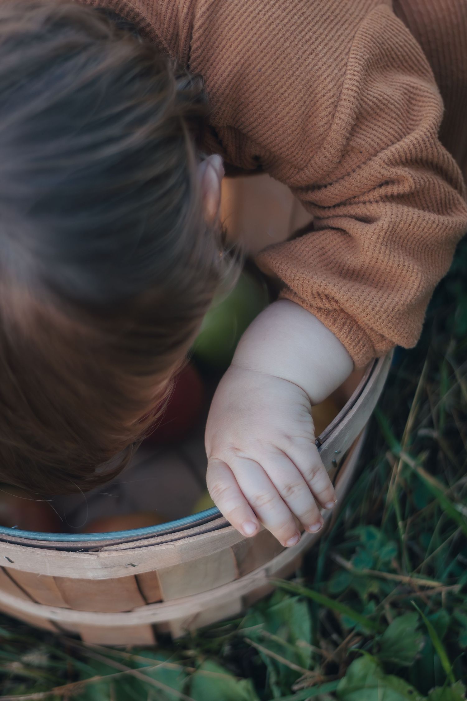 A close-up sequence of hands wearing white gloves carefully examining and opening a book in an outdoor setting.
