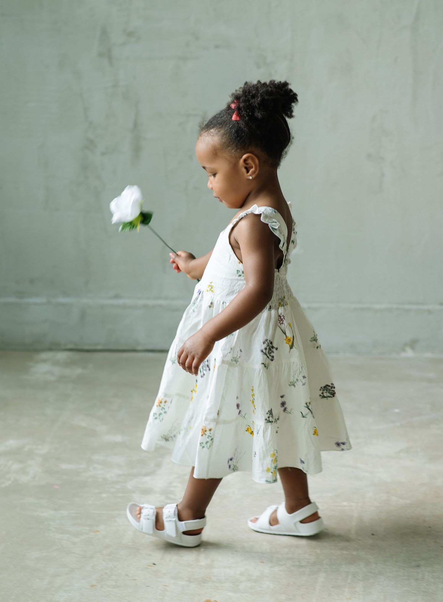 Daughter walking with flower