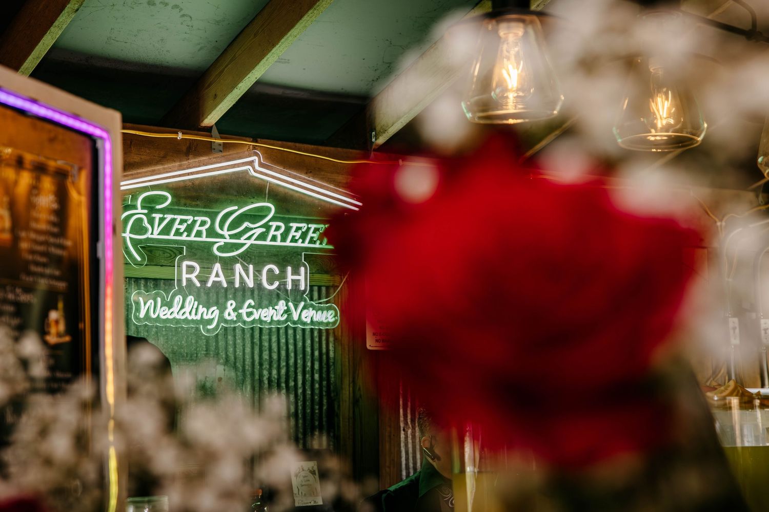 Blurred neon signs glowing in soft focus at night creating an atmospheric ambiance.