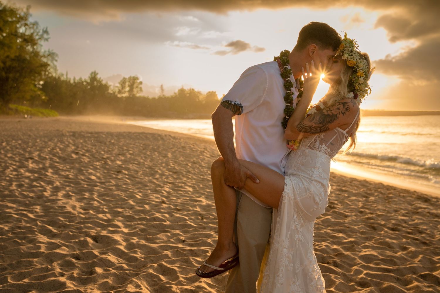 A romantic sunset beach moment captured with ocean waves in the background.