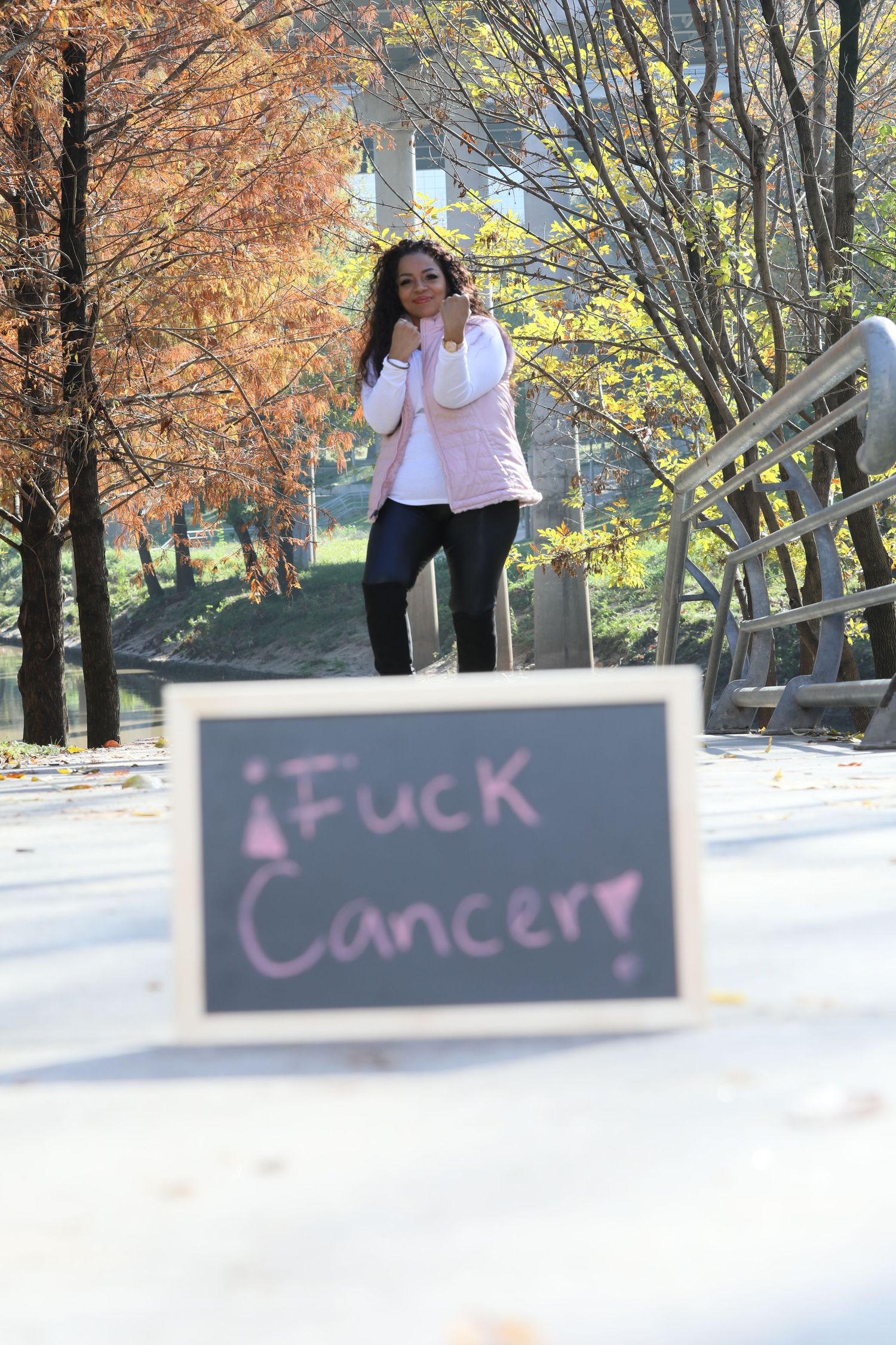 Cancer awareness photo featuring chalkboard message and autumn scenery.