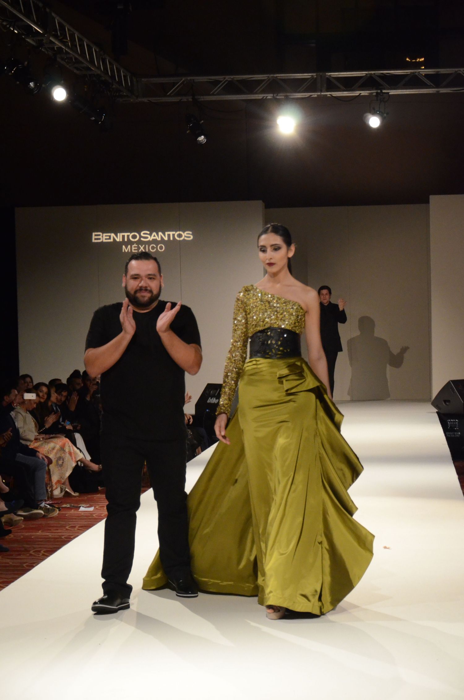 Designer and model presenting yellow gown finale at Benito Santos fashion show.