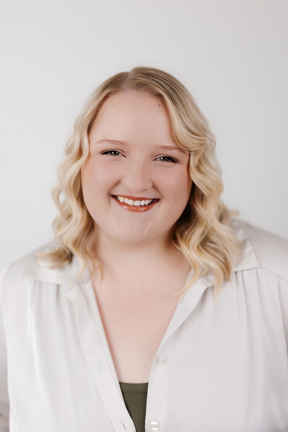 Headshot of Charli smiling