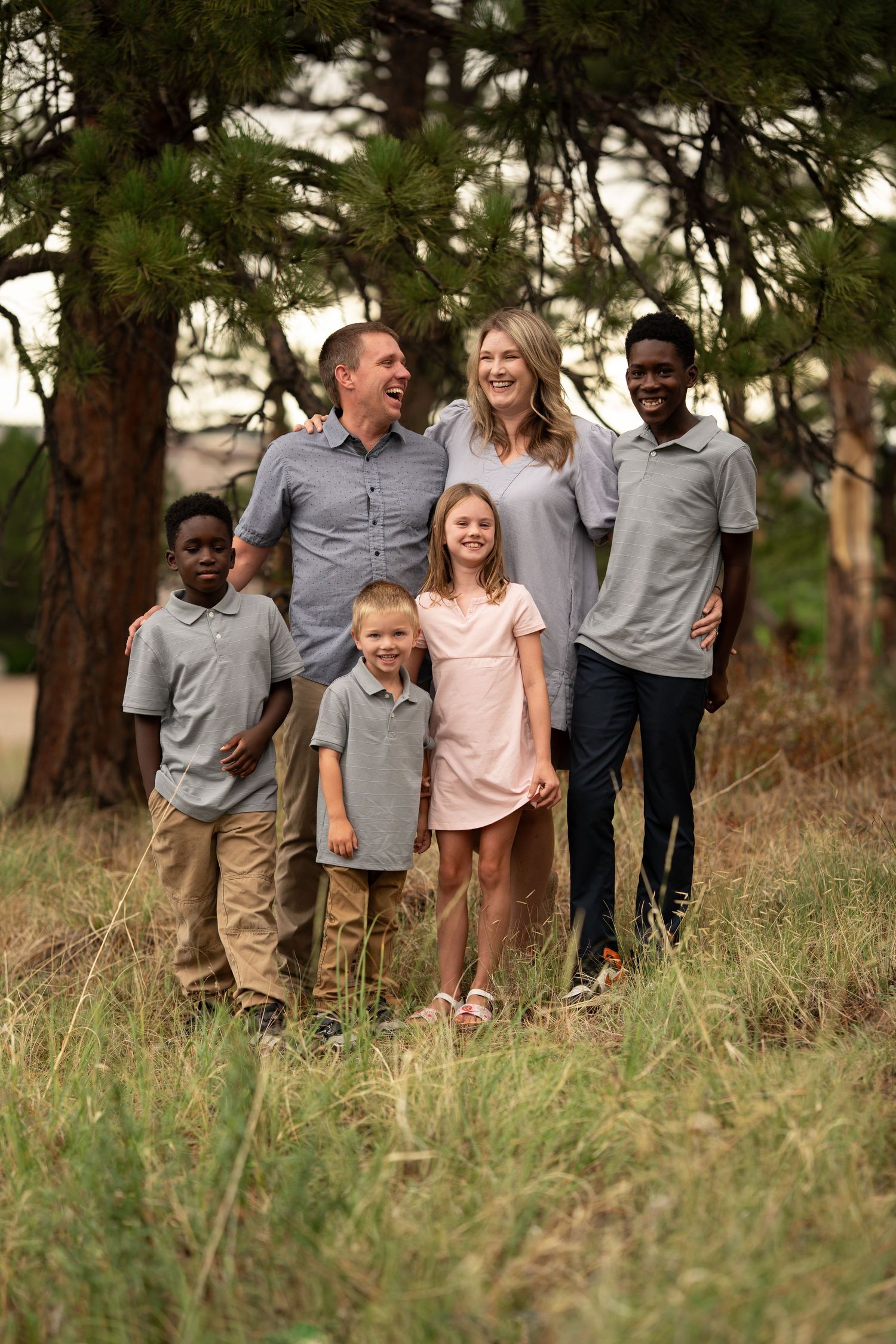 Family laughing overcast day.